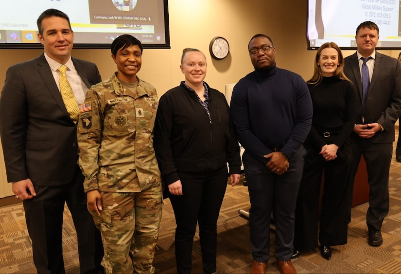 SFC Cyrus, SFC Stanfill and SSG Passey received coins for exceptional performance supporting Army CID from CSM Whittington during the symposium