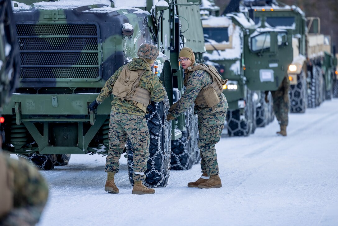 U.S. Marines with 2nd Marine Aircraft Wing, II Marine Expeditionary Force, attach snow chains to the wheels of a medium tactical-vehicle replacement during a slippery-road training course in preparation for Exercise Nordic Response 24 at Setermoen, Norway, Feb. 8, 2024. Exercise Nordic Response, formerly known as Cold Response, is a NATO training event conducted every two years to promote military competency in arctic environments and to foster interoperability between the U.S. Marine Corps and allied nations. (U.S. Marine Corps photo by Cpl. Christopher Hernandez)