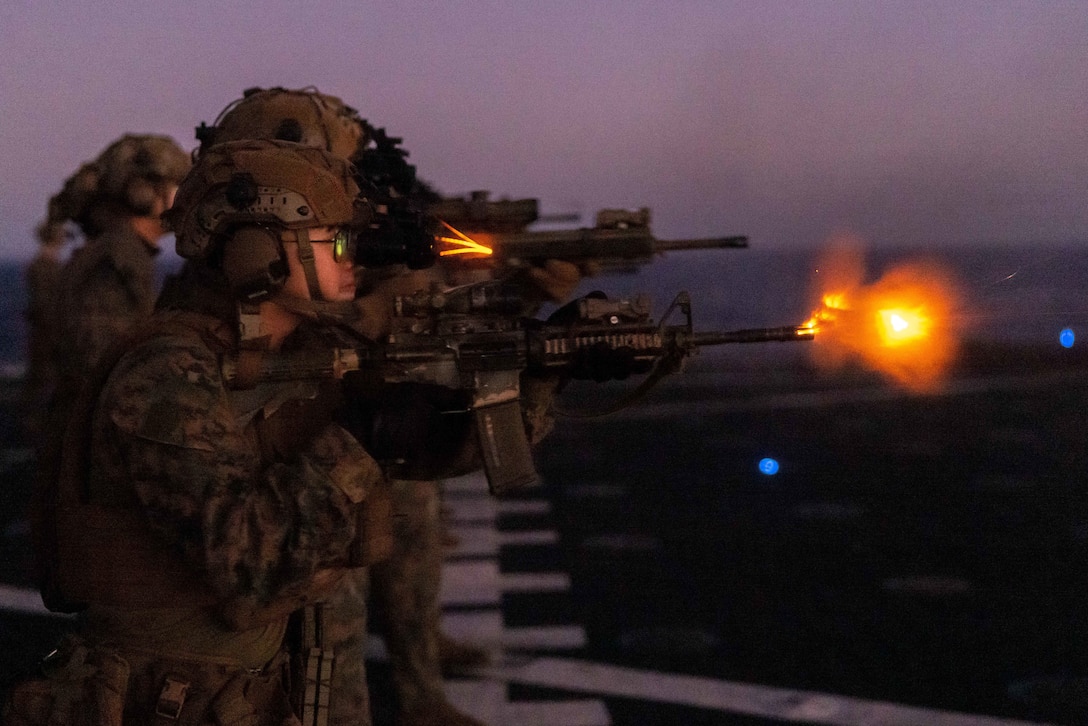 U.S. Navy Petty Officer 3rd Class Danny Nguyen, a hospital corpsman with the 26th Marine Expeditionary Unit’s (Special Operations Capable) (26 MEU(SOC)) Ground Combat Element, fires an M4 Carbine during a night range aboard harpers ferry-class dock landing ship USS Carter Hall (LSD-50), Feb. 5, 2024. The Bataan Amphibious Ready Group, with the embarked 26 MEU(SOC) is on a scheduled deployment in the U.S. Naval Forces Europe area of operations, employed by U.S. Sixth Fleet to defend U.S., Allied and partner interests. (U.S. Marine Corps photo by Cpl. Rafael Brambila-Pelayo)