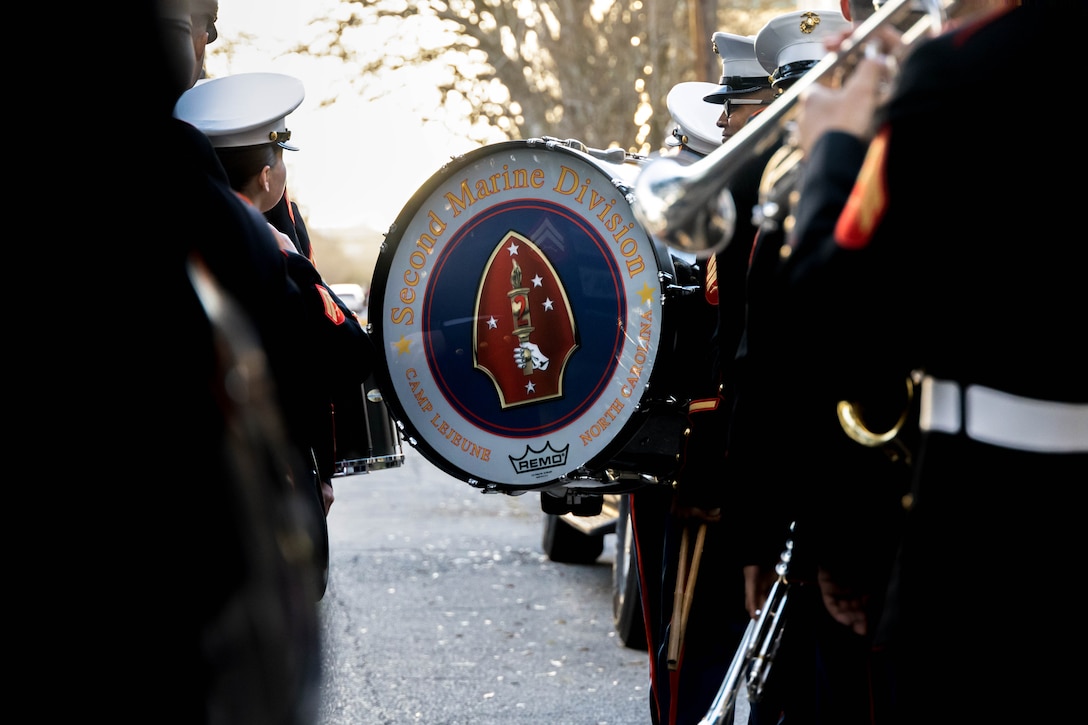 U.S. Marines with the 2d Marine Division (MARDIV) Band form up during the Knights of Chaos parade in New Orleans, Louisiana, Feb. 8, 2024. The 2d MARDIV Band performed during Mardi Gras to support the local community through a joint effort with Marine Corps Forces Reserve Band to help bridge the gap between the Marine Corps and the people who support them. (U.S. Marine Corps photo by Lance Cpl. Kylie Lake)
