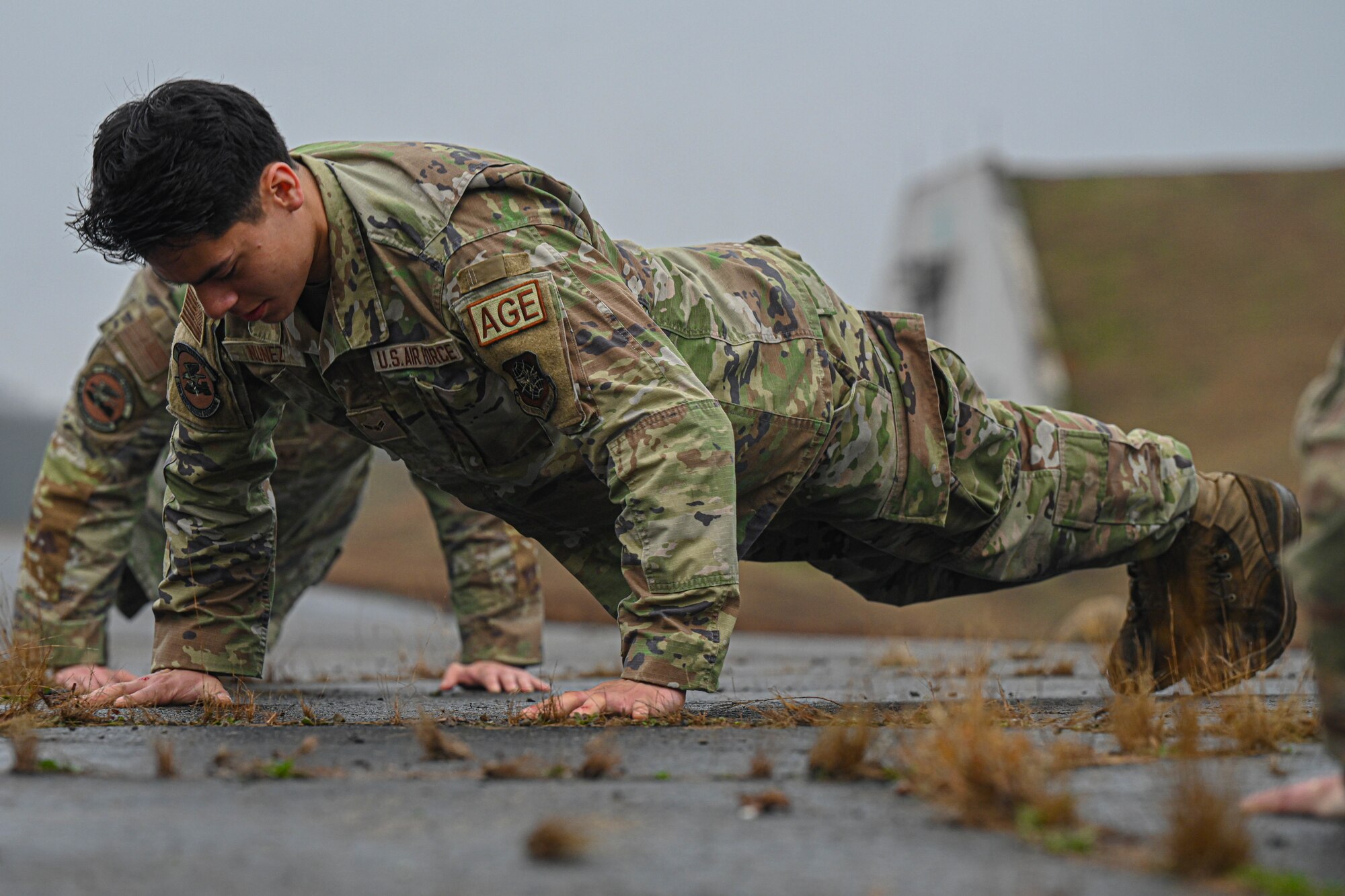 An airman assigned to the 19th Maintenance Squadron completes push-ups during the Readiness Games at Little Rock Air Force Base, Arkansas.