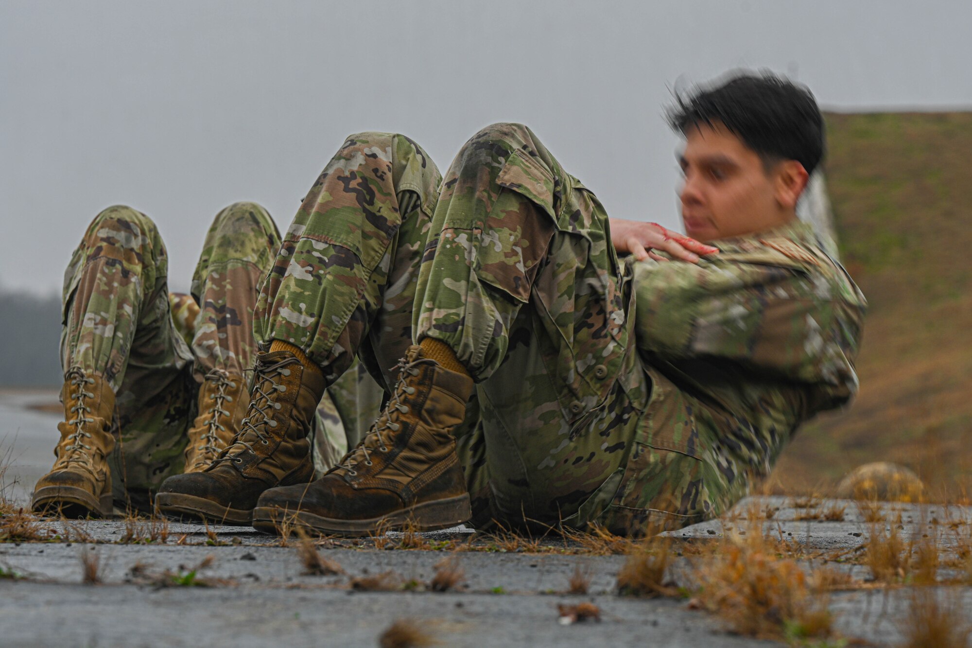 An airman assigned to the 19th Maintenance Squadron completes sit-ups during the Readiness Games at Little Rock Air Force Base, Arkansas.