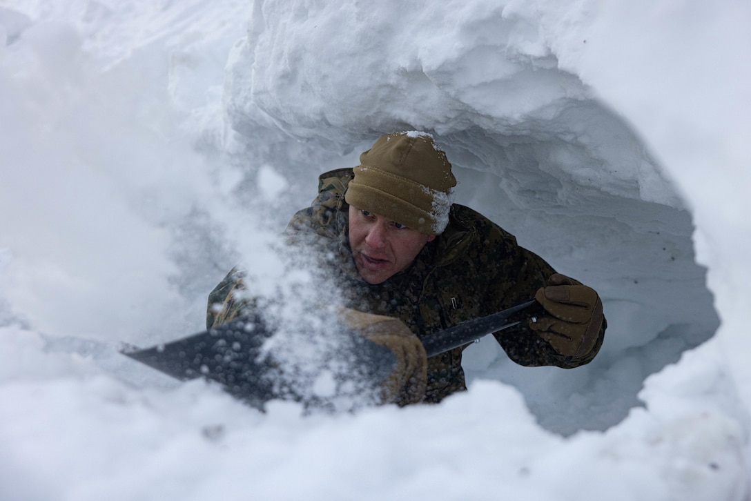 U.S. Marine Corps 1st Lt. Jacob Ballard, a native of Rhode Island and a communication strategy and operations officer with the 2nd Marine Aircraft Wing, builds a snow-cave shelter during a four-day cold-weather training course in preparation for Exercise Nordic Response 24 at Setermoen, Norway, Feb. 13, 2024. Exercise Nordic Response, formerly known as Cold Response, is a NATO training event conducted every two years to promote military competency in arctic environments and to foster interoperability between the U.S. Marine Corps and allied nations. (U.S. Marine Corps photo by Lance Cpl. Orlanys Diaz Figueroa)