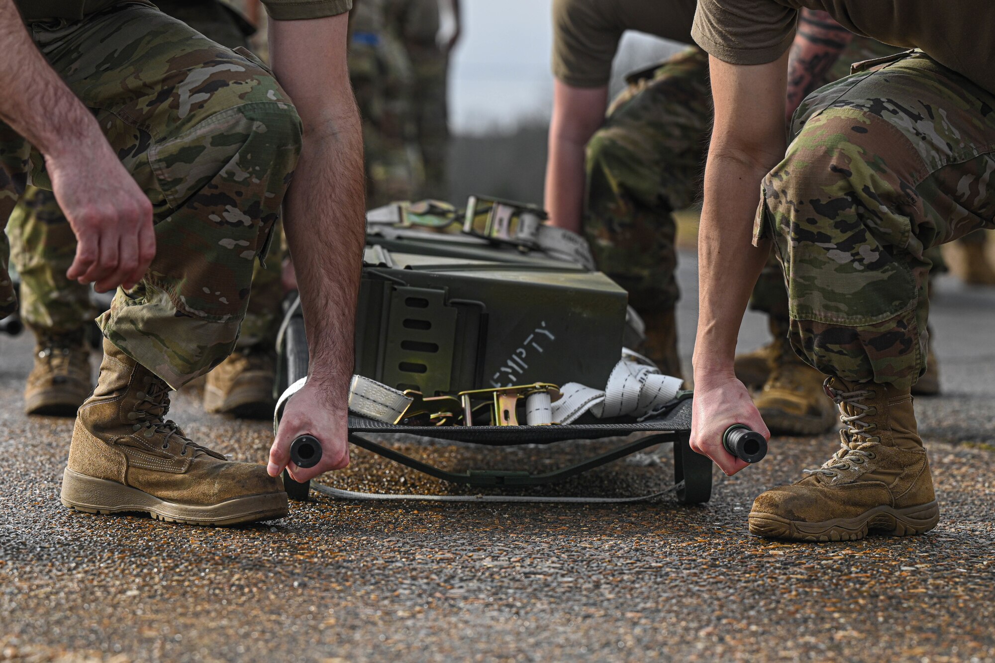 Airmen assigned to the 19th Maintenance Squadron start a litter carry during the Readiness Games at Little Rock Air Force Base, Arkansas.
