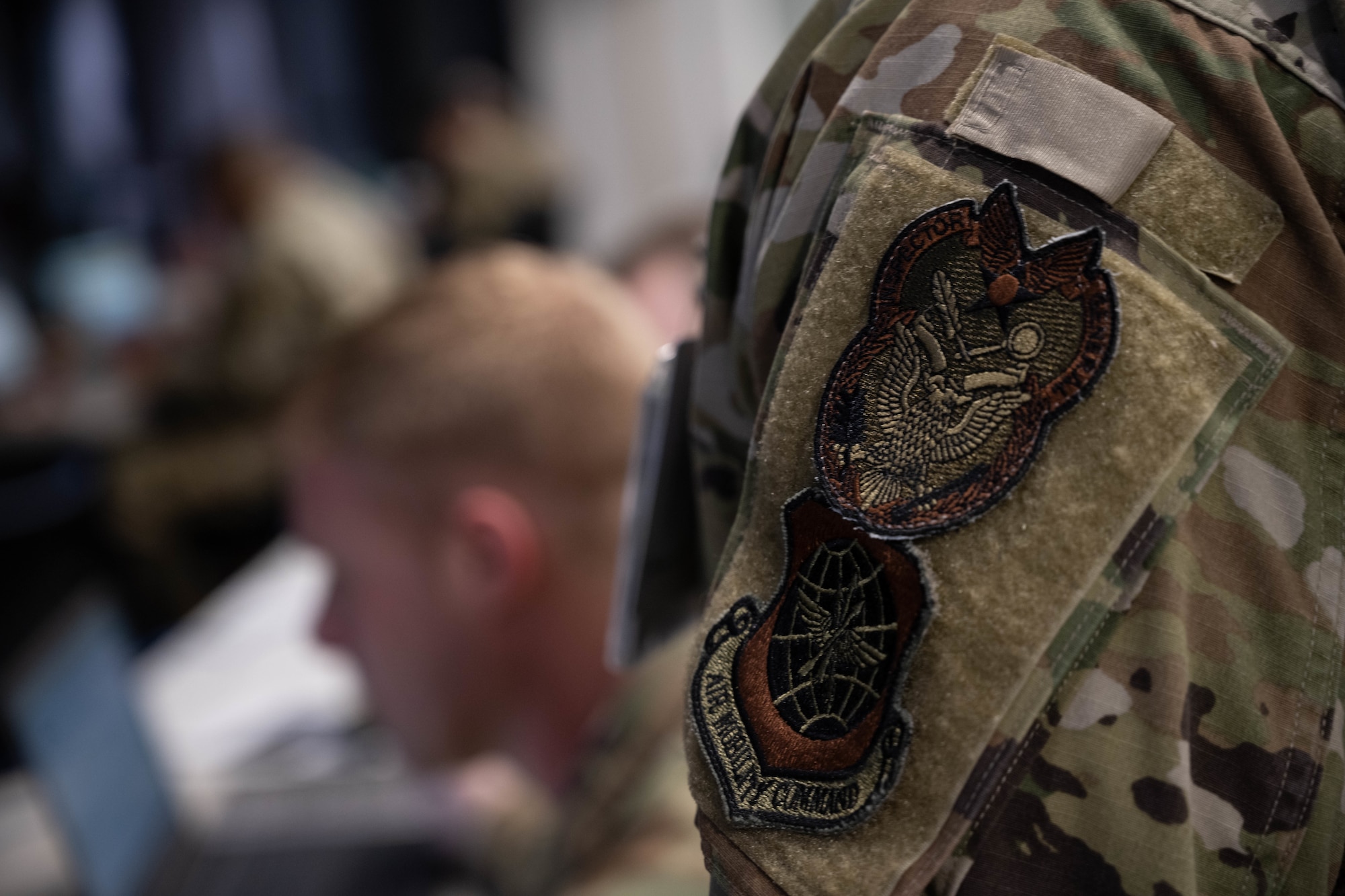 Unit identifiers sit on Air Force uniform