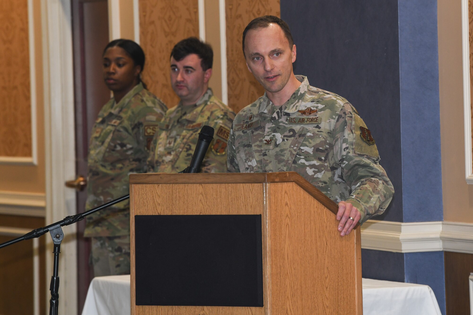 Military member at podium.