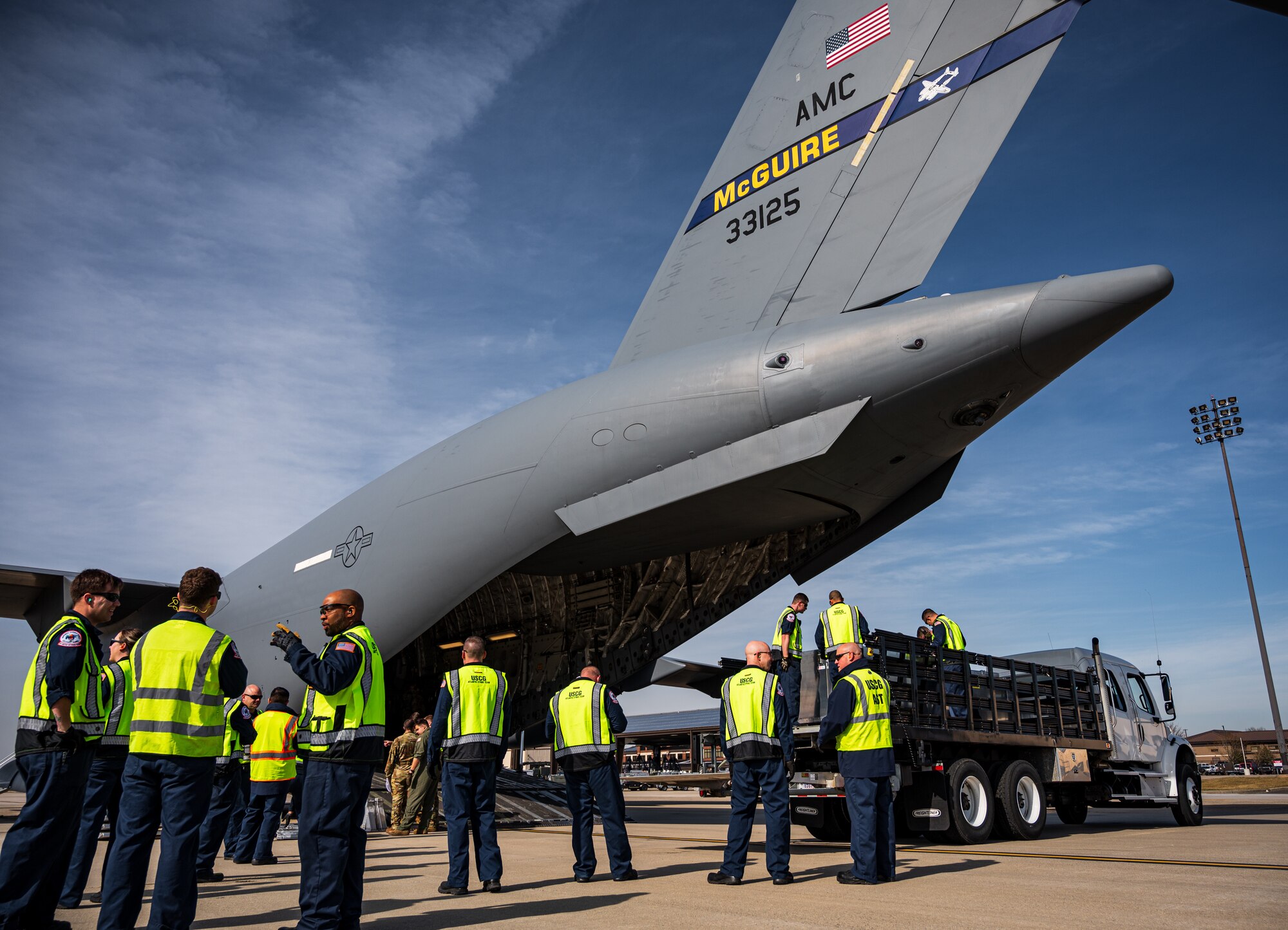 The joint exercise included the loading and offloading of equipment and vehicles onto a C-17, as well as various inspections and documentation. Exercises like these are made possible by the leveraging of assets of Joint Force partners across the Department of Defense’s only tri-service base.  (U.S. Air Force photo by Senior Airman Sergio Avalos)