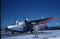 FacebookXCopy LinkEmailShare
USCG Air Station Barbers Point - Coast Guard Aviator Bobby Wilks next to his USCG UF-1G/HU-16E Albatross before a TransPac from Air Station Barbers Point to Port Angeles.