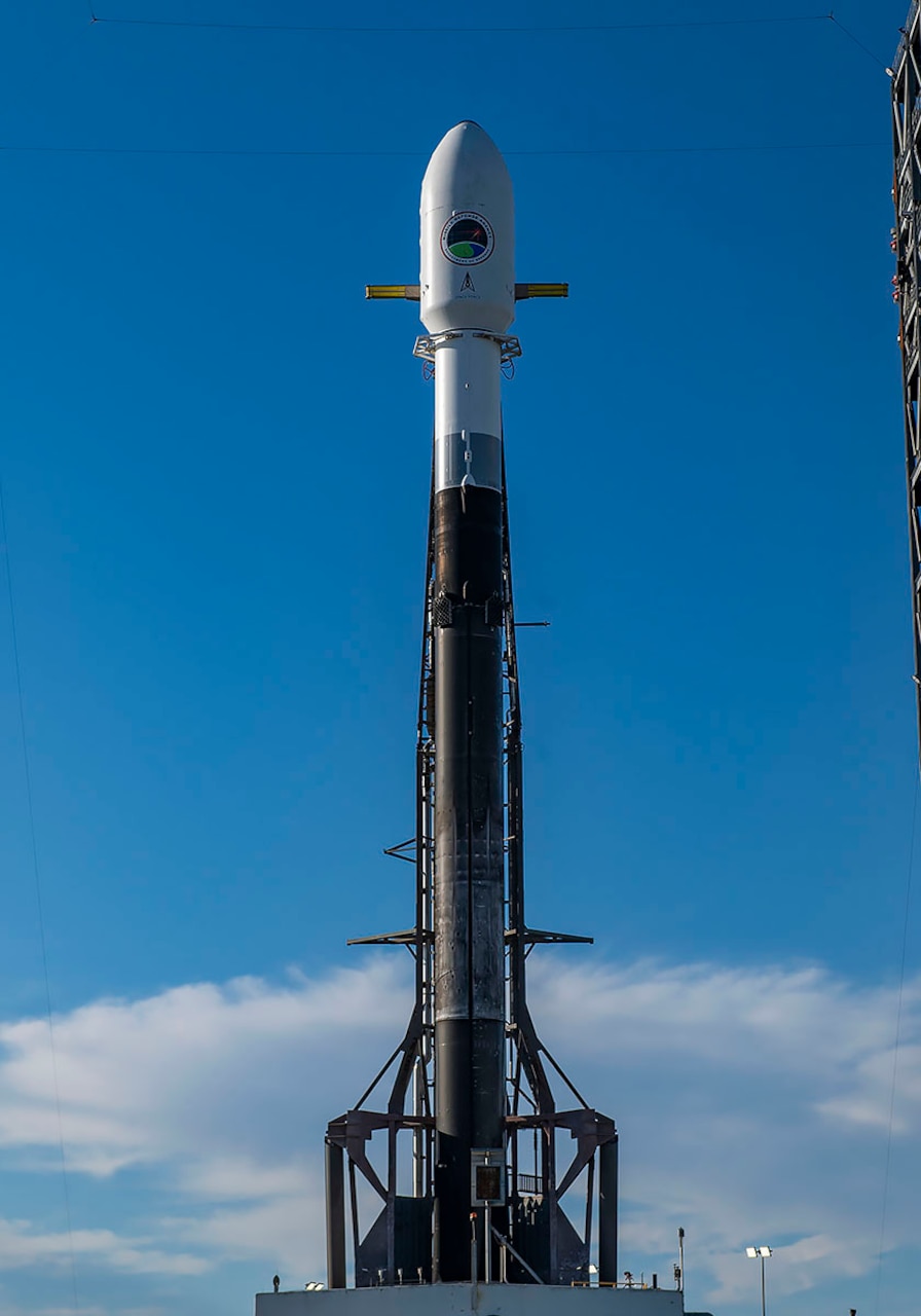 A rocket sits on a launchpad.