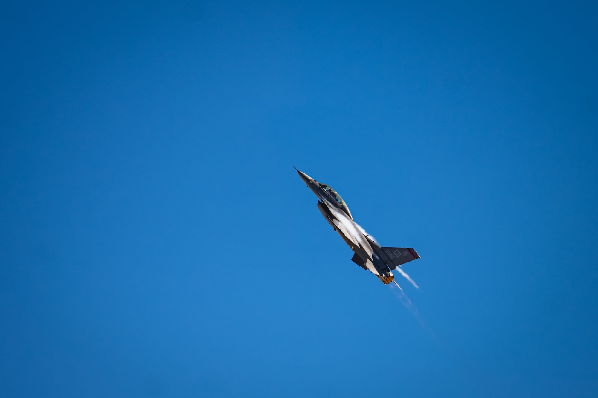 F-16 jet flies upwards