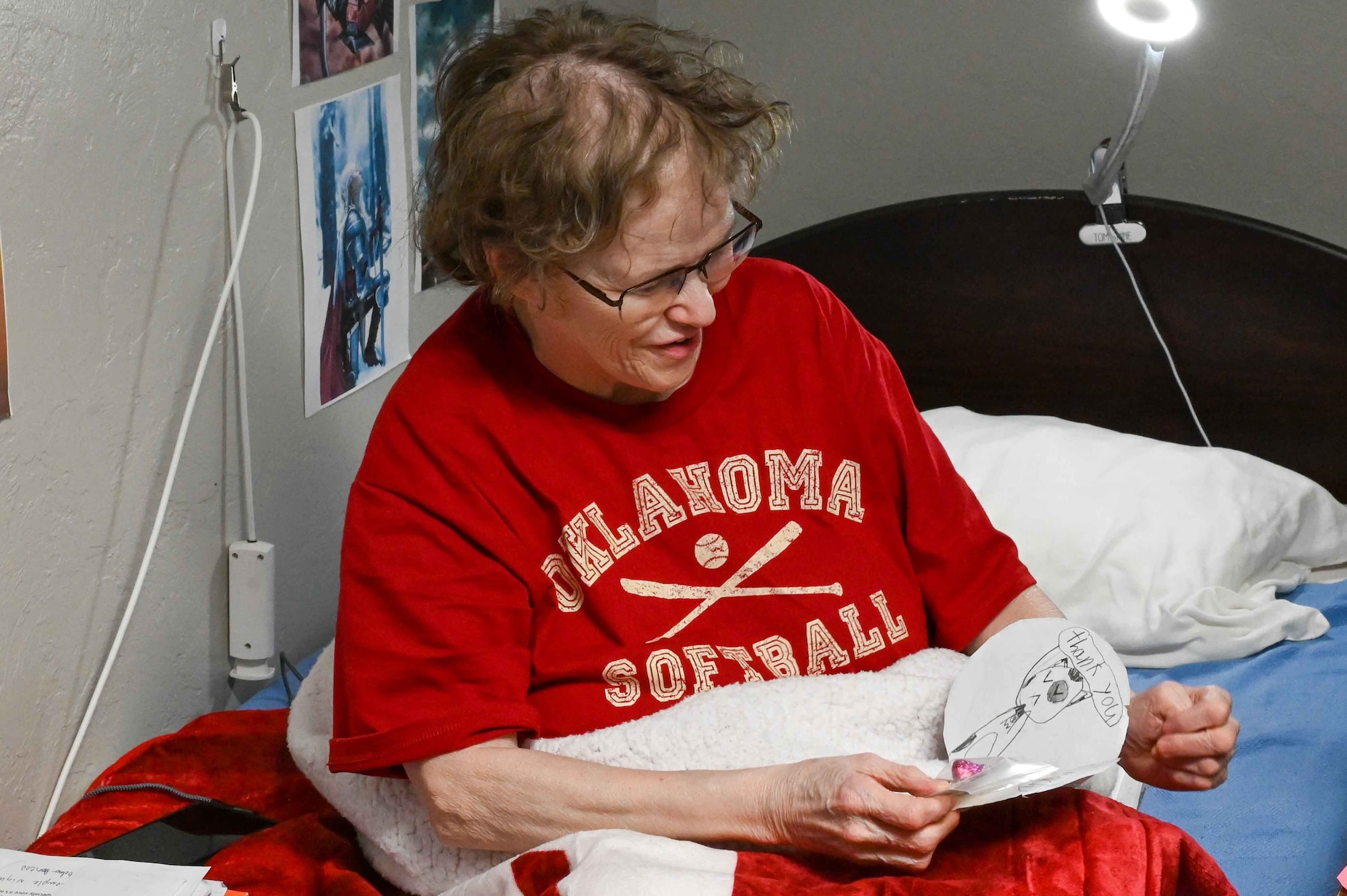 Shirley Hudson, a former supply sergeant in the Army, opens a Valentine’s Day card at English Village Manor in Altus, Oklahoma, Feb. 14, 2024. Hudson is originally from Altus and served in the Army for 16 years. (U.S. Air Force photo by Airman 1st Class Kari Degraffenreed)