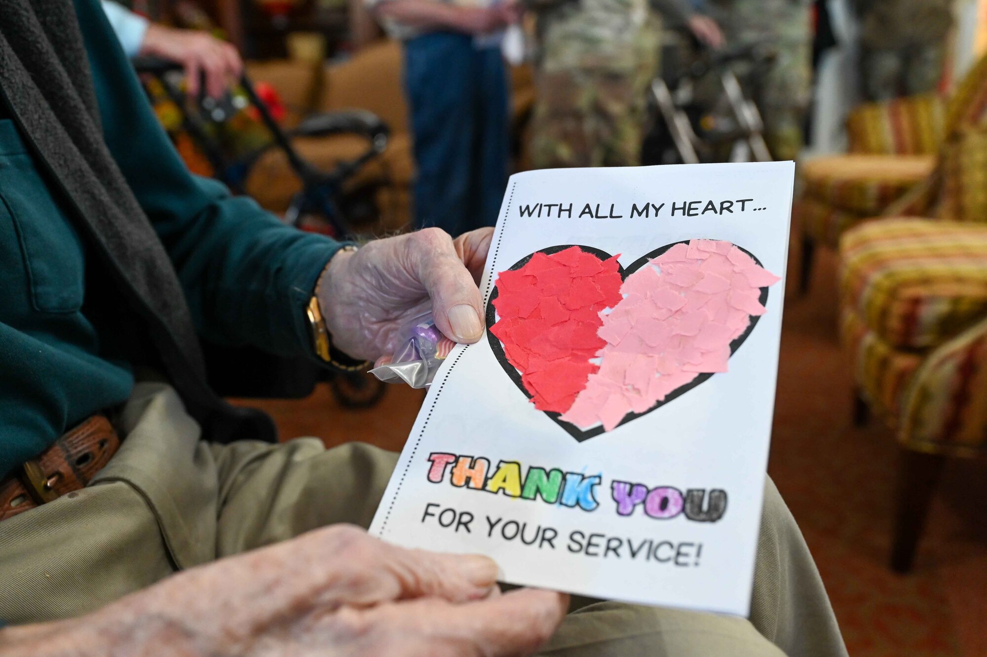 Paul Kay, a former baker in the Army Air Corps, holds up the Valentine’s Day card given to him at Tamarack Assisted Living Center in Altus, Oklahoma, Feb. 14, 2024. Students from a local elementary school made the cards to celebrate veterans on Valentine’s Day. (U.S. Air Force photo by Airman 1st Class Kari Degraffenreed)