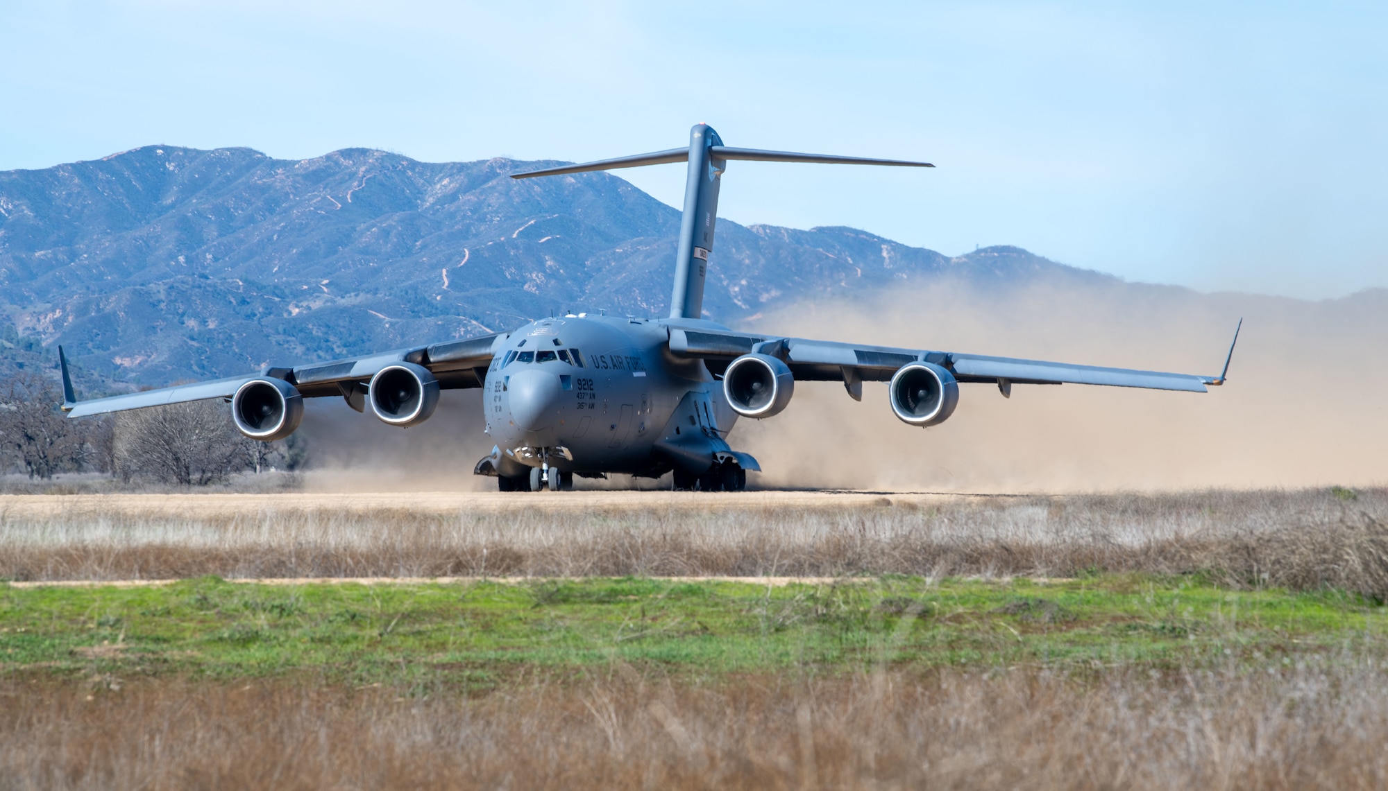 A C-17 Globemaster III aircraft assigned to Joint Base Charleston, South Carolina, takes off from a semi-prepared runway during exercise Bamboo Eagle 24-1, Jan. 29, 2024. Through the use of designated air space, BE provides Airmen, allies and partners a flexible, combat-representative, multidimensional battlespace to conduct testing tactics development, and advanced training in support of U.S. national interests. (U.S. Air Force photo by Senior Airman Christian Silvera)