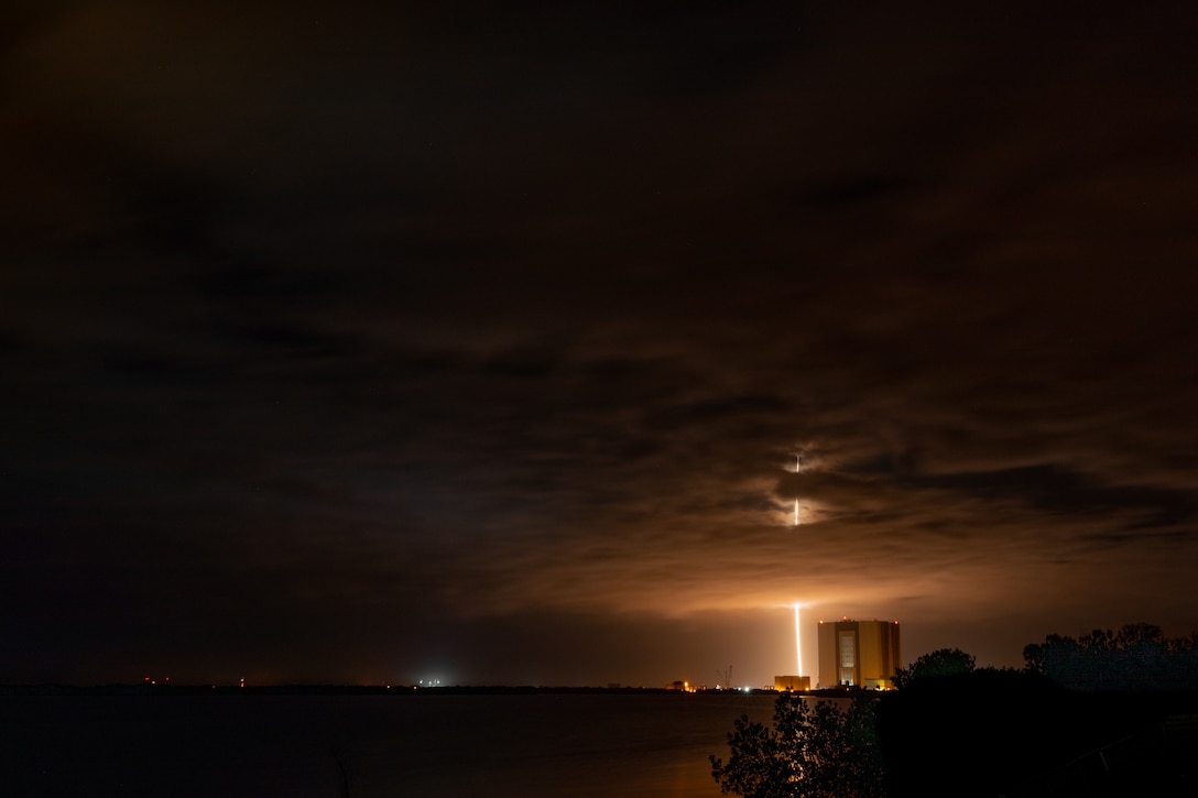 SpaceX Falcon 9 first stage rocker booster returns to a landing pad and lights up the nighttime sky at Kennedy Space Center in Florida after the successful launch of NASA's Plankton, Aerosol, Cloud, and ocean Ecosystem (PACE) mission into orbit at 1:33 a.m. ET on Feb. 8, 2024.

The United States Marine Band wrote and performed a musical piece, PACE Fanfare, dedicated to the mission, and performed it for Goddard Space Flight Center staff in Greenbelt, Md. on May 3, 2023.

(U.S. Marine Corps photo by Staff Sgt. Chase Baran/released)