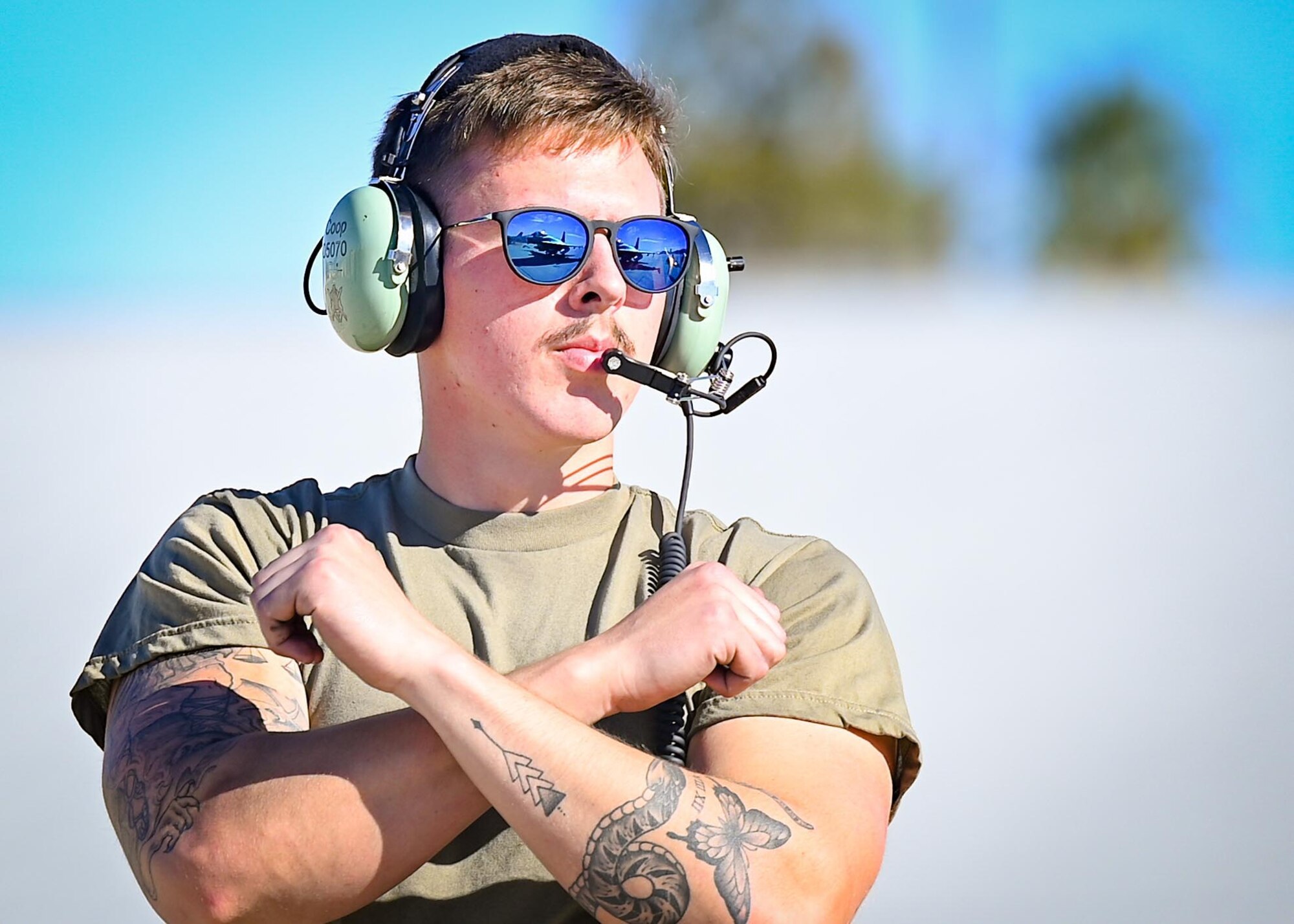 An Airman marshals an aircraft.