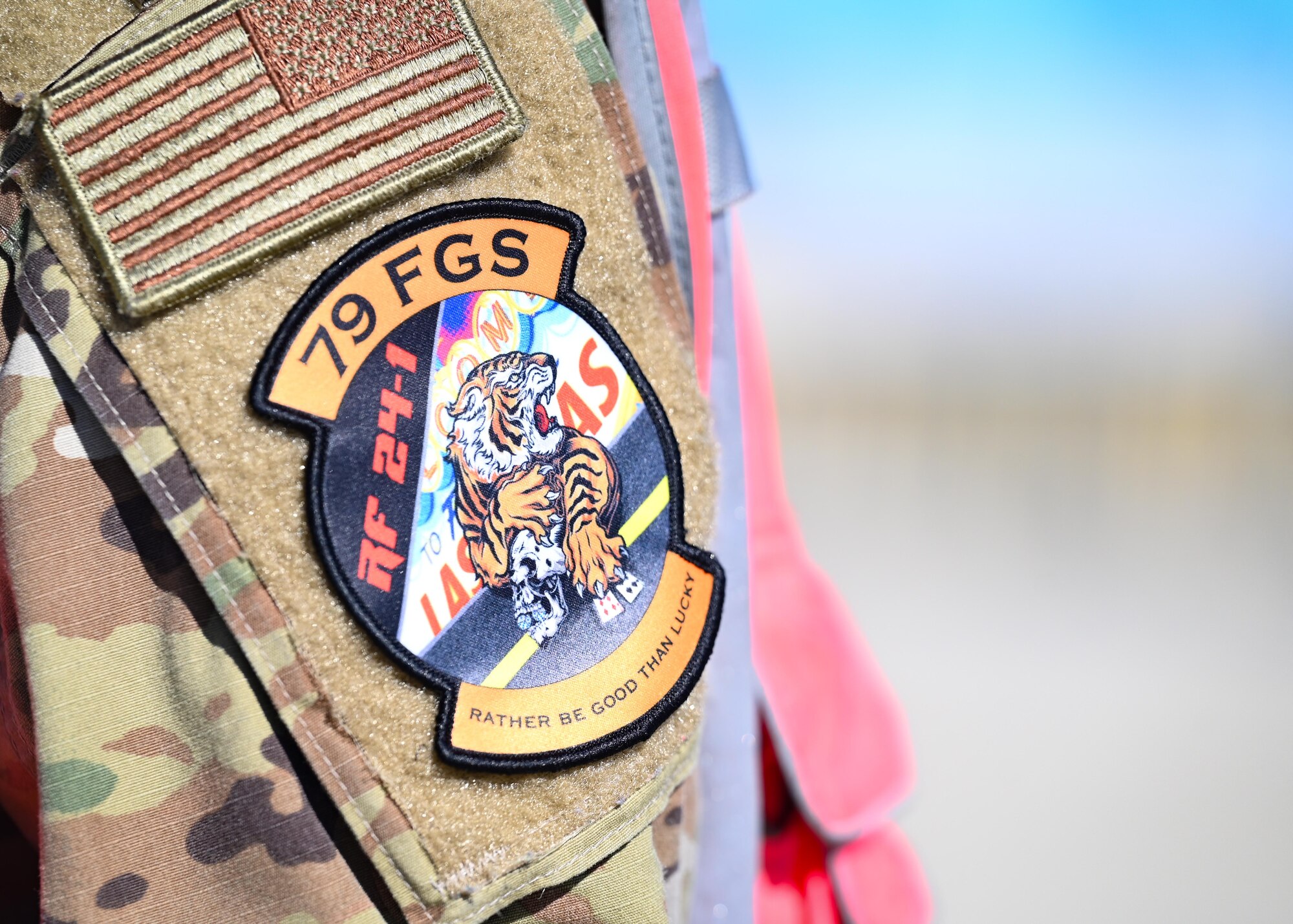 A patch is worn by an Airman reading 'Red Flag Nellis 24-1.'