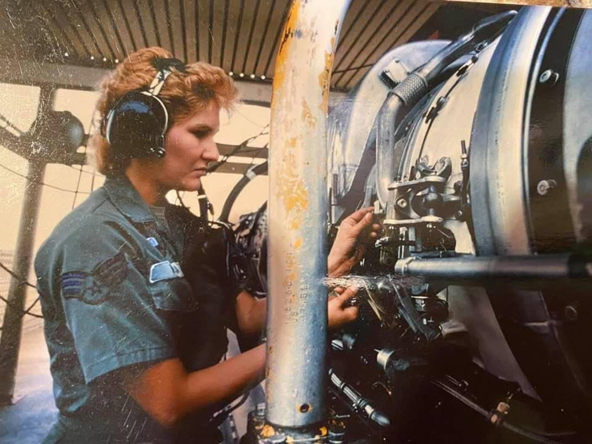 U.S. Air Force Airman Teresa Reson works on a jet engine while serving at George Air Force Base.
