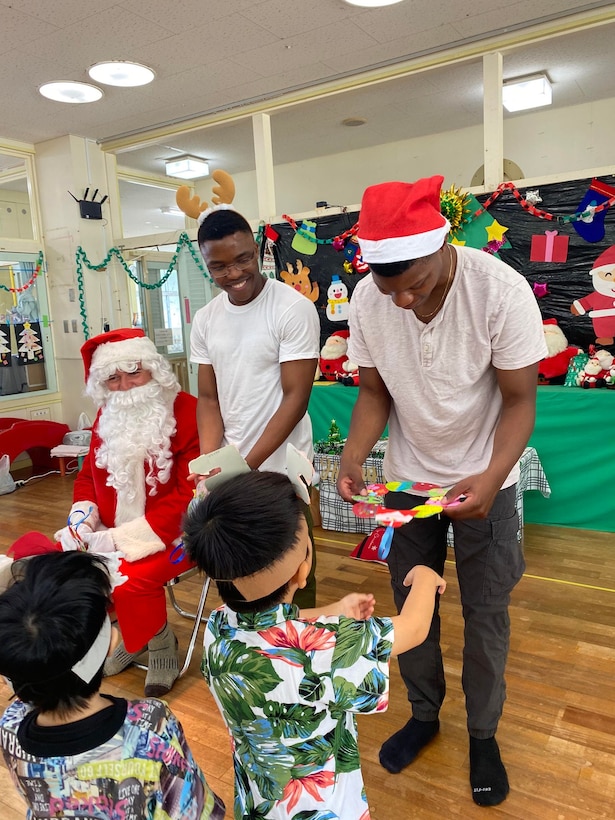 U.S. Marines and Sailors deliver presents during the holiday season to local children at Taguchi Nursery in Okinawa, Japan, Dec. 15, 2023. The Marines and Sailors of 2d Battalion, 2d Marine Regiment dedicated 770 hours to community service during their six-month deployment in Okinawa. The battalion contributed to the local community by cleaning up trash on local beaches, provided English lessons at local schools and sponsored a foster home during the holiday season.  2/2 is forward deployed in the Indo-Pacific under 4th Marine Regiment, 3d Marine Division as part of the Unit Deployment Program. (Courtesy Photo)