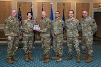 group of Airmen holding trophy