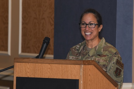 Woman standing at podium.