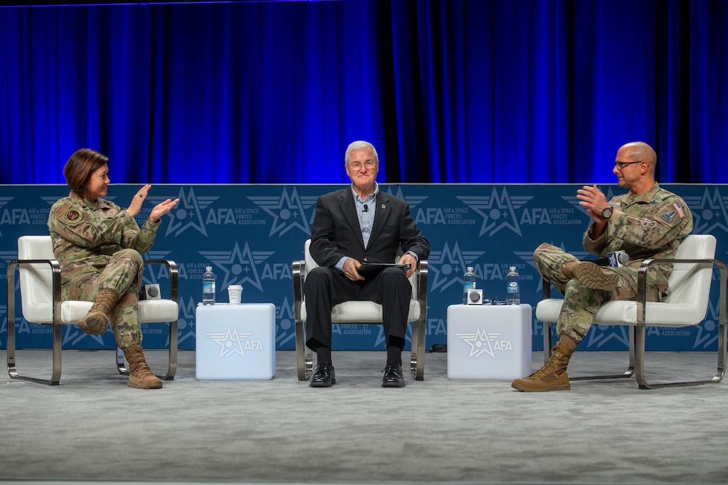 Chief Master Sgt. of the Air Force JoAnne Bass, Gerald Murry, the 14th Chief Master Sgt. of the Air Force and Chief Master Sgt. of the Space Force John Bentivegna discus the importance of properly empowering, training and equipping the enlisted force to prepare for Great Power Competition during a panel Feb. 14, 2024, at the Air and Space Forces Warfare Symposium in Aurora, Colo.