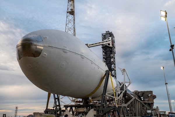 A rocket sits on a metal platform.