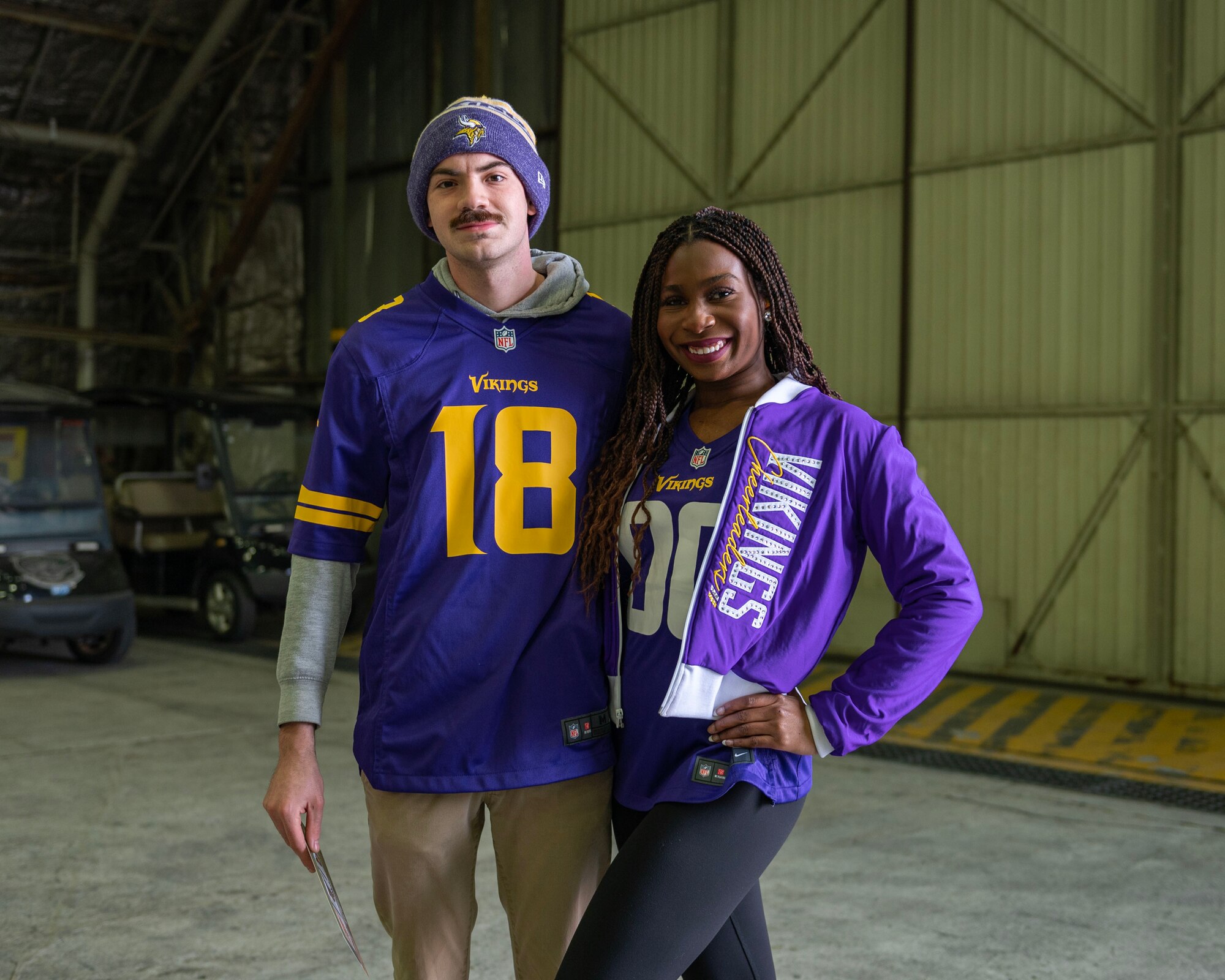 U.S. Air Force Senior Airman Pedro Gaytan, 36th Fighter Generation Squadron dedicated crew chief, takes a photo with Krystia Tolkinen, an NFL cheerleader, during the Pro Blitz 2024 unit visit at Osan Air Base, Republic of Korea, Feb. 10, 2024. The NFL Pro Blitz is a week of events for military communities leading up to Super Bowl Sunday.  (U.S. Air Force photo by Staff Sgt. Aubree Owens)