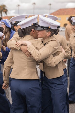 U.S. Marines with Echo Company, 2nd Recruit Training Battalion, congratulate each other after their graduation ceremony at Marine Corps Recruit Depot San Diego, California, Feb. 9, 2024. Graduation took place at the completion of the 13-week transformation, which included training for drill, marksmanship, basic combat skills, and Marine Corps customs and traditions. (U.S. Marine Corps photo by Lance Cpl. Alexandra M. Earl)