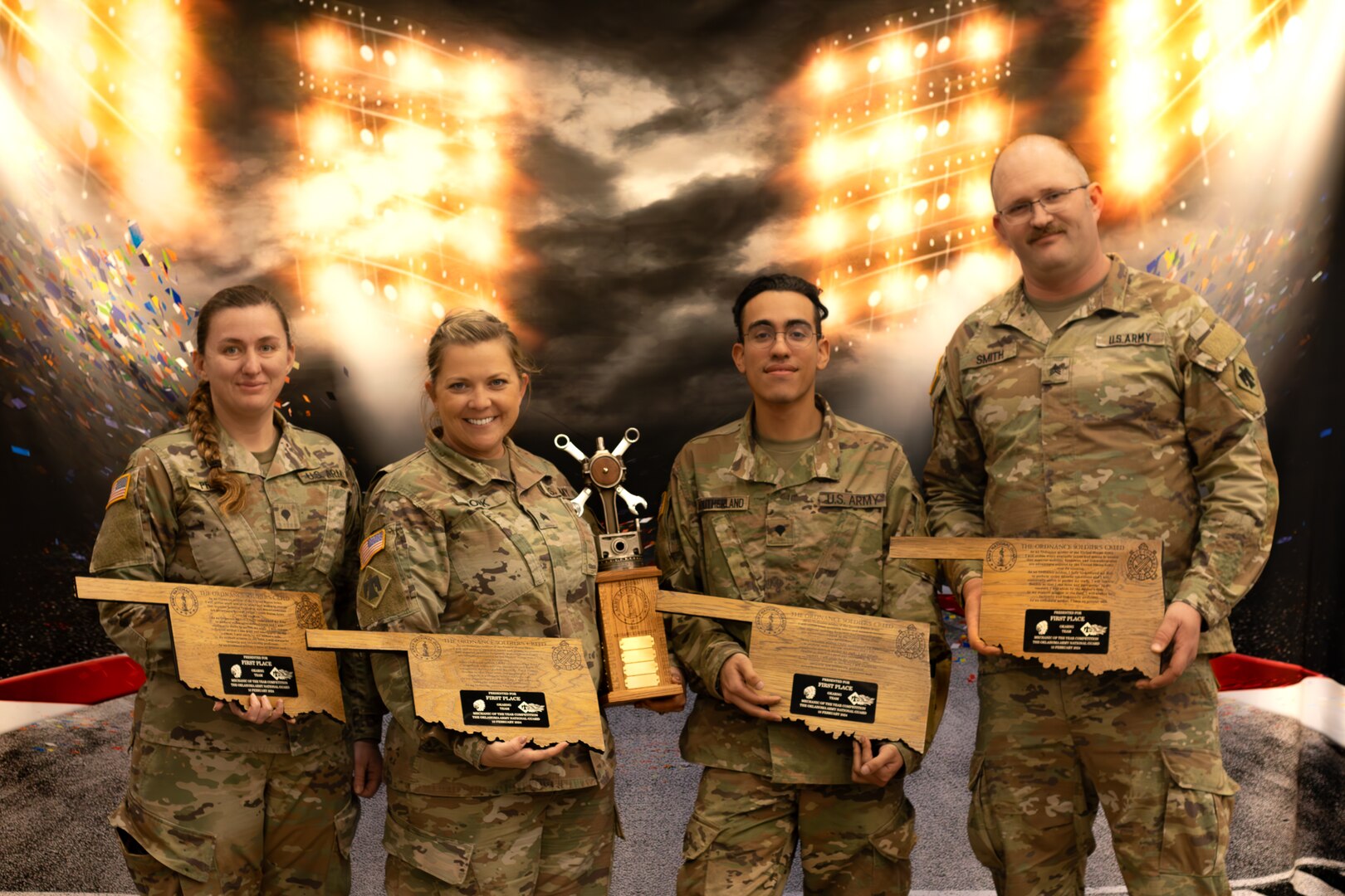 (From left to right) Oklahoma Army National Guardsmen Spc. Shawnda Preast, Sgt. Hope York, Spc. Demitri Southerland and Sgt. Samuel Smith, a mechanic team representing the 345th Combat Sustainment Support Battalion, 90th Troop Command, pose with their award after winning first overall team in the traditional Guardsmen category at the third annual Mechanic of the Year competition held at the Combined Support Maintenance Shop in Norman, Oklahoma, Feb. 10, 2024. (Oklahoma National Guard photo by Cpl. Danielle Rayon)