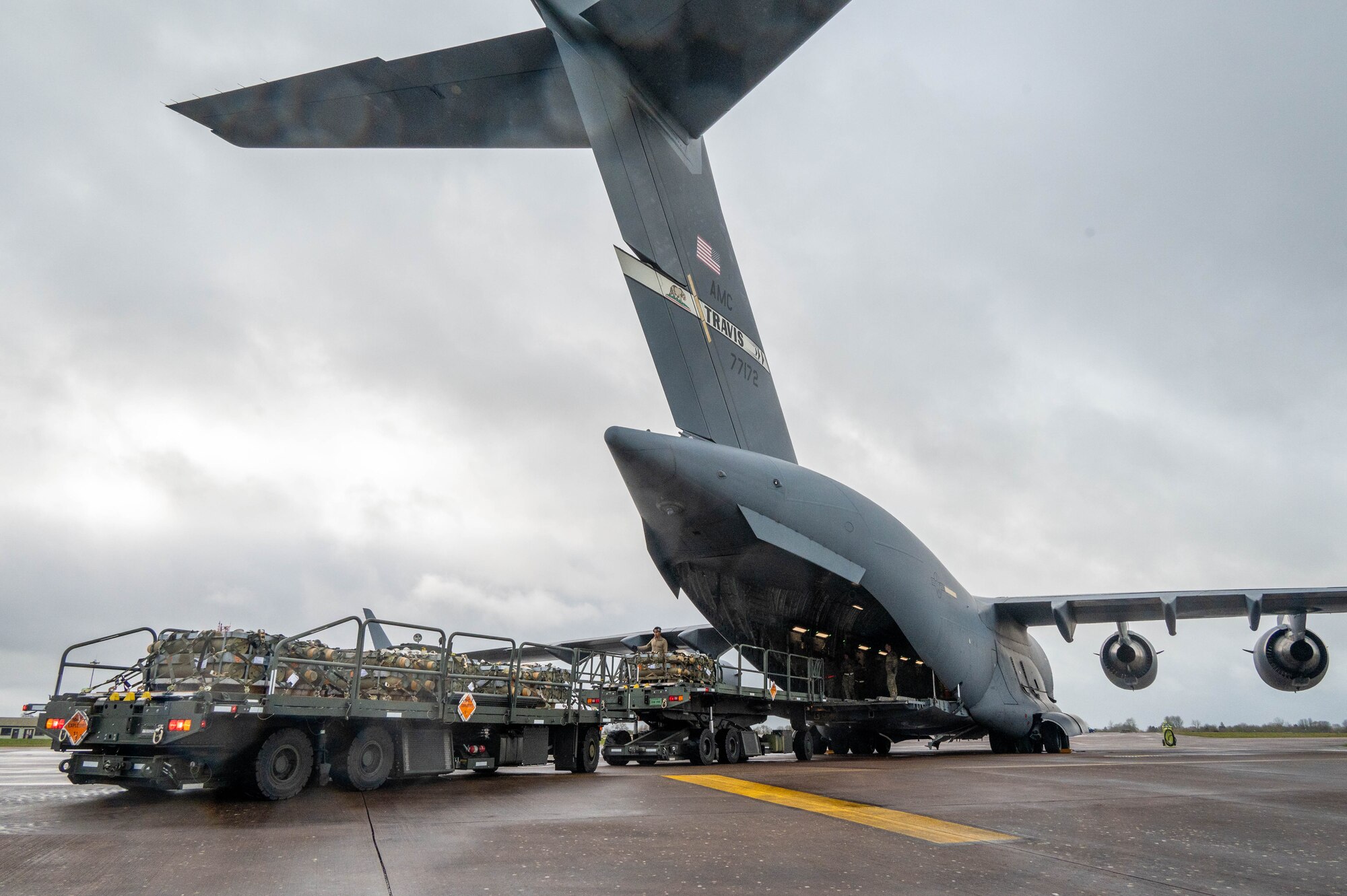 Airmen load pallets onto a C-17 Globemaster III