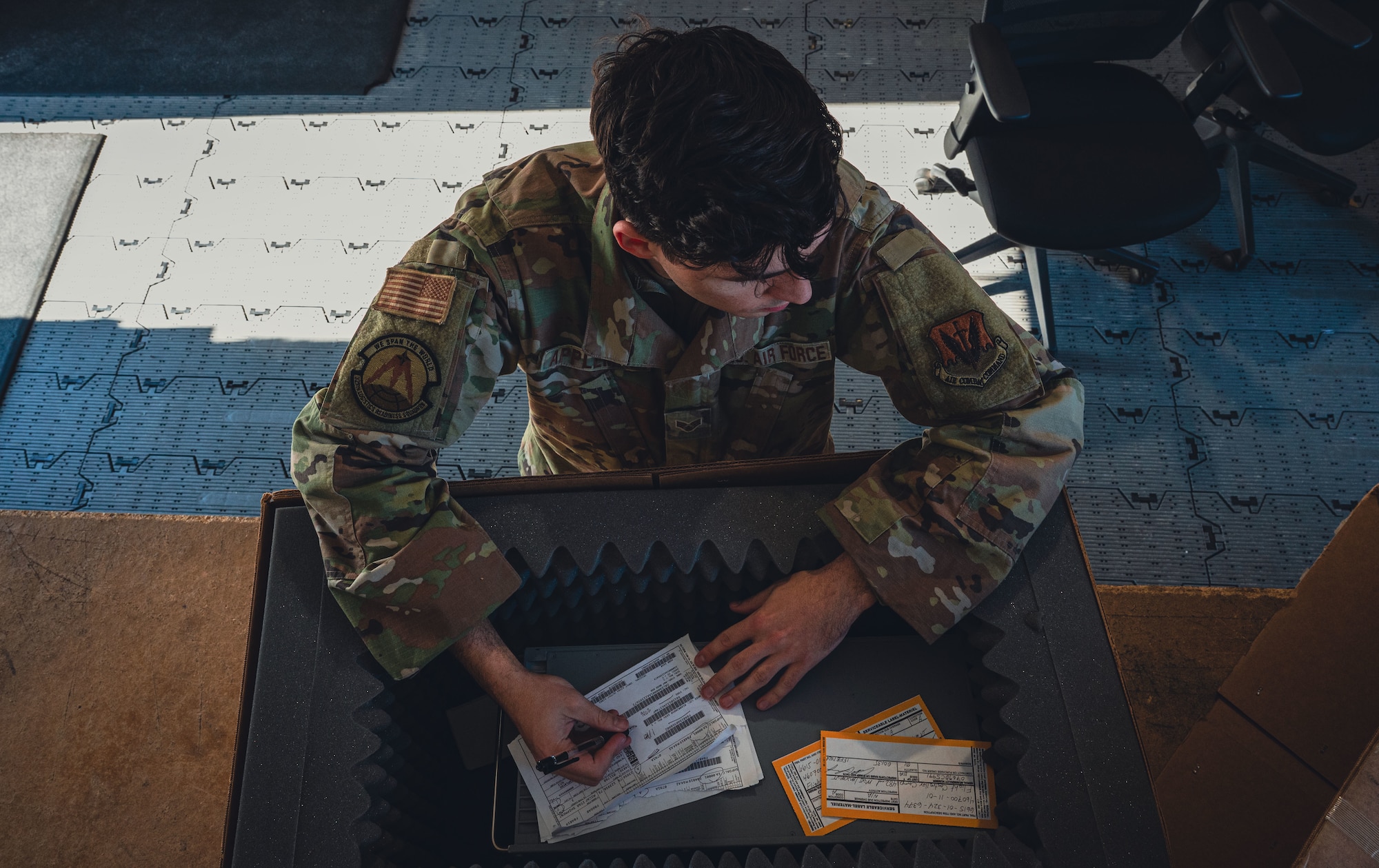 Service member signs label.