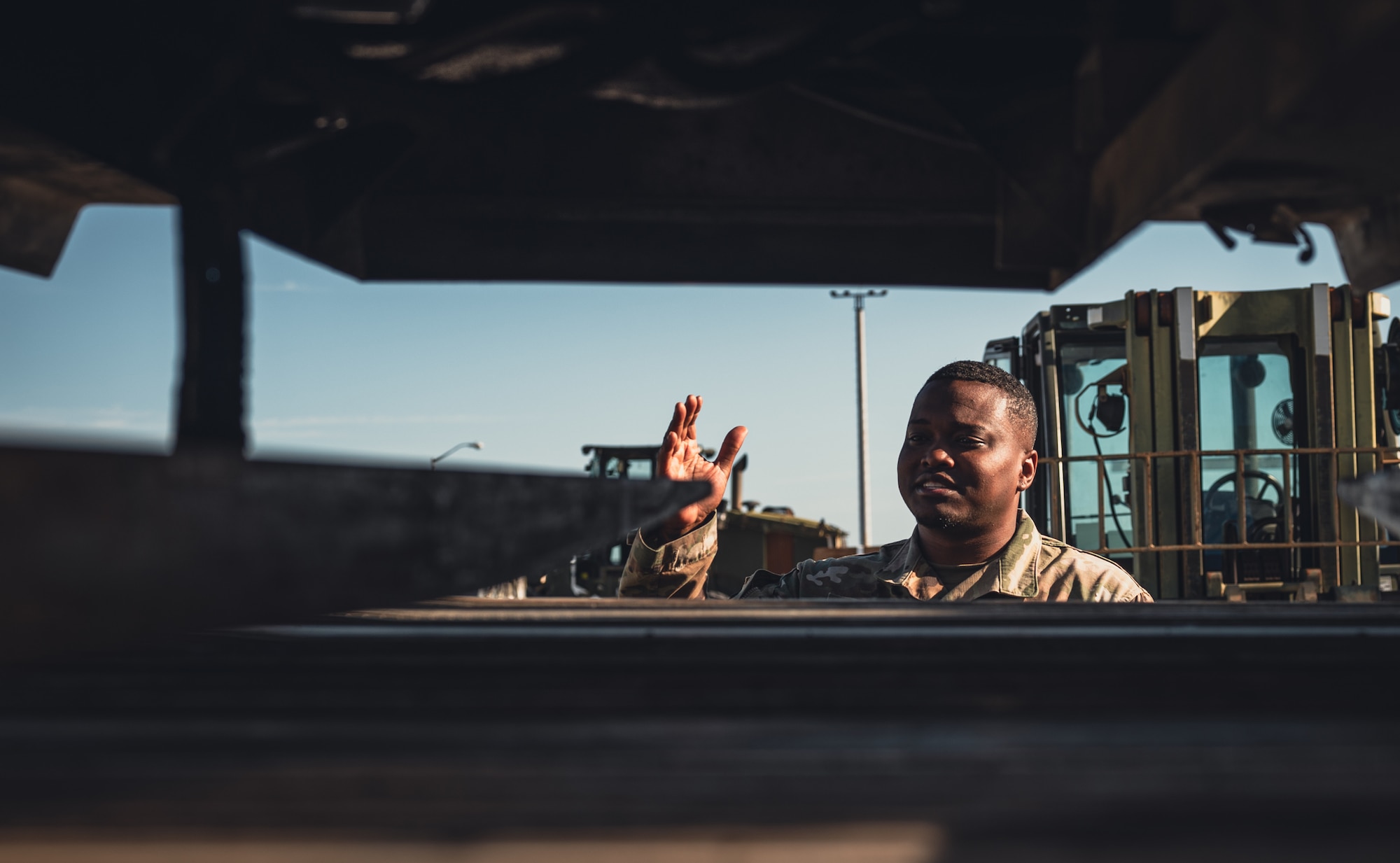 Service member directs cargo.