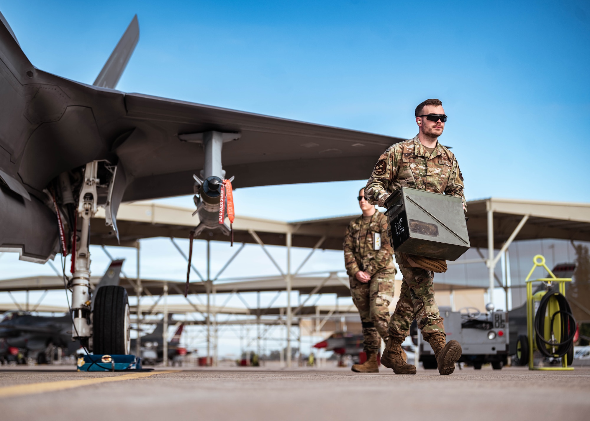 U.S. Air Force Senior Airman Aaron Vind, 62nd Aircraft Maintenance Unit weapons load crew member, hauls equipment during the annual weapons load competition.