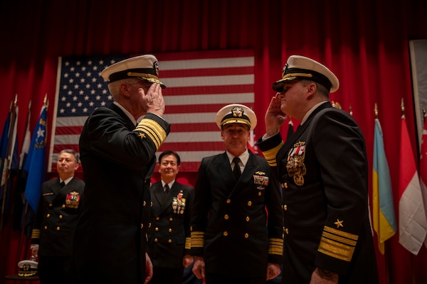 Vice Adm. Karl Thomas, left, turns over command of Commander, U.S. 7th Fleet to Vice Adm. Fred Kacher, right, during the U.S. 7th Fleet Change of Command ceremony onboard Commander, Fleet Activities Yokosuka, Feb. 15.