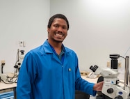 Branden Burns, a scientist at NSWC Crane, photographed in the lab where he conducts failure analysis microelectronics testing.