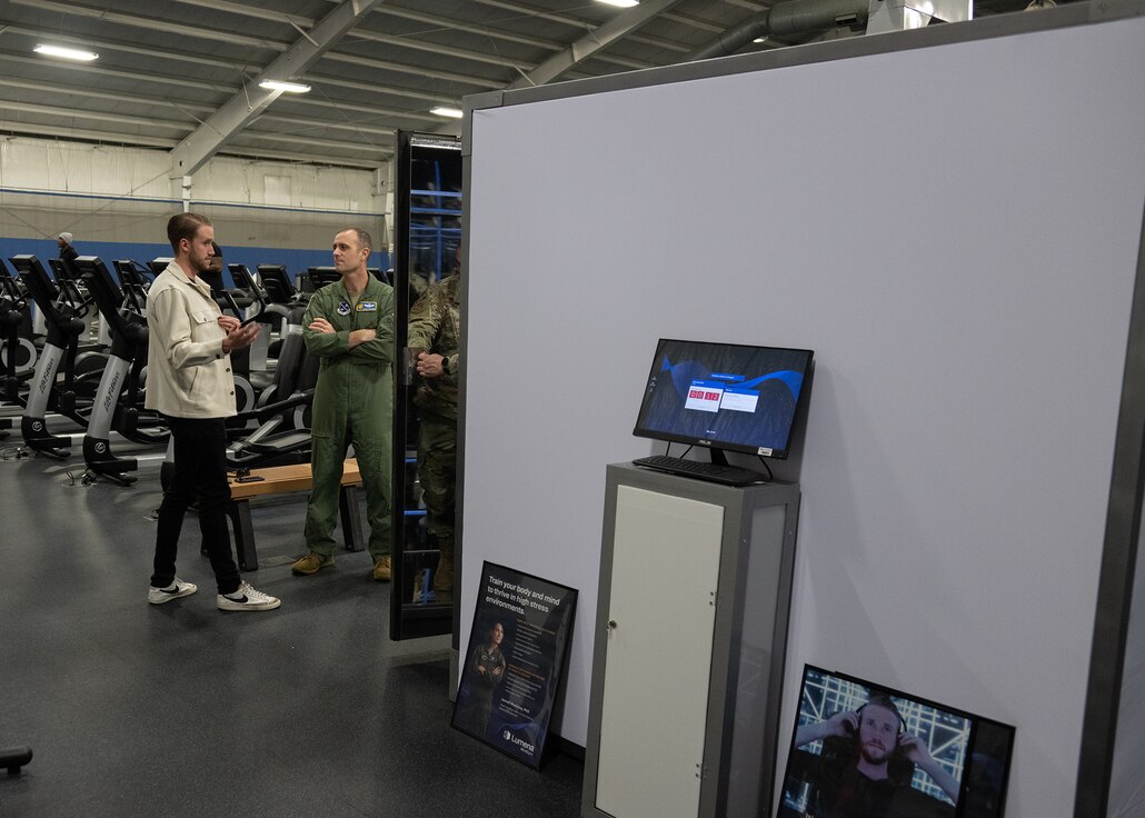 Brandon Murphy, left, head of growth at Lumena, speaks about the new installation of MindGym to U.S. Air Force Col. Parkin C. “Gage” Bryson, 316th Wing deputy commander, at the Tactical Fitness Center at Joint Base Andrews, Md., Feb. 9, 2024.