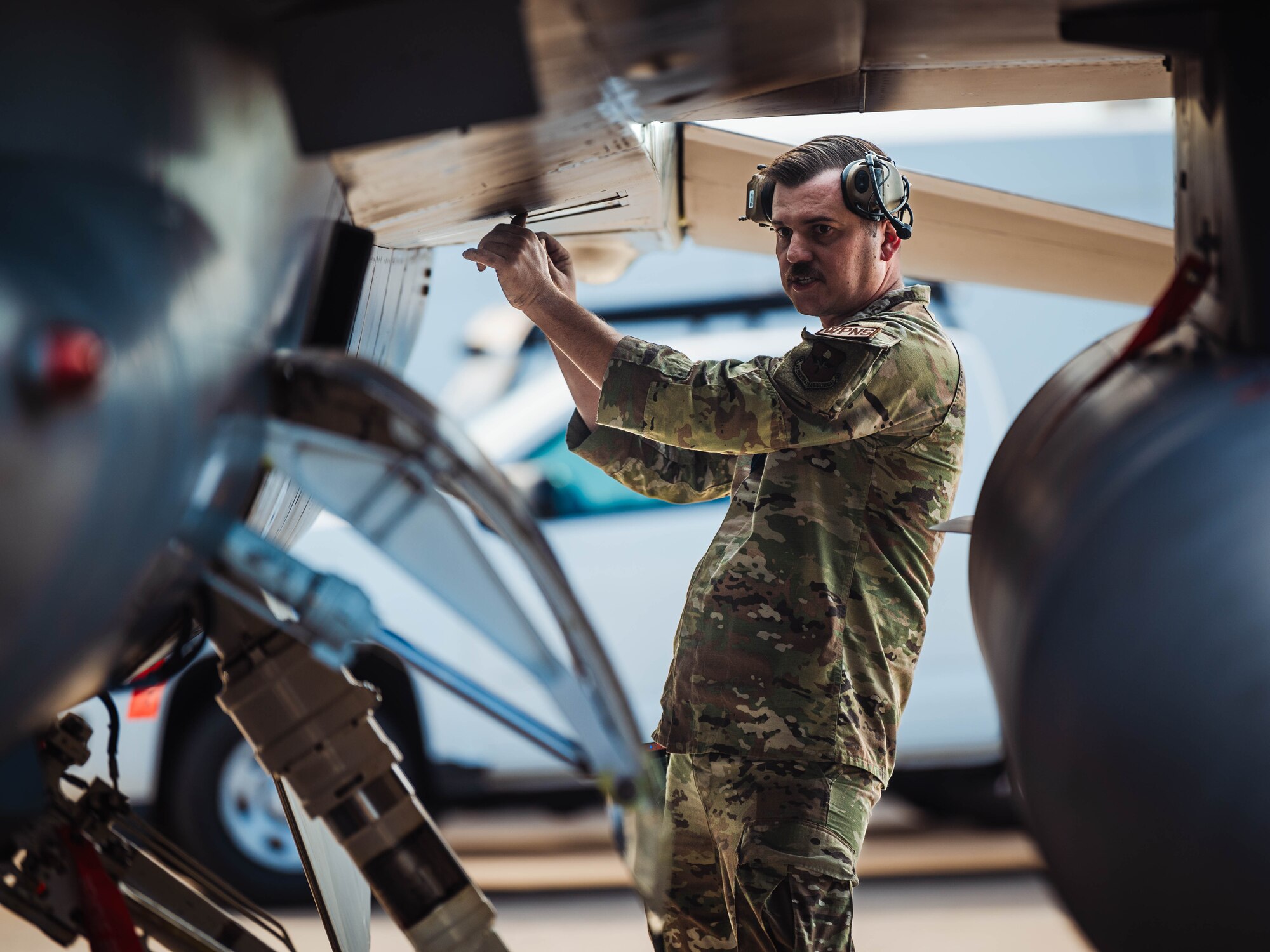 U.S. Air Force Staff Sgt. Kevin Bates, 309th Fighter Squadron weapons load crew member, prepares a GBU-12 Paveway II bomb for a U.S. Air Force F-16 Fighting Falcon during the annual weapons load competition.