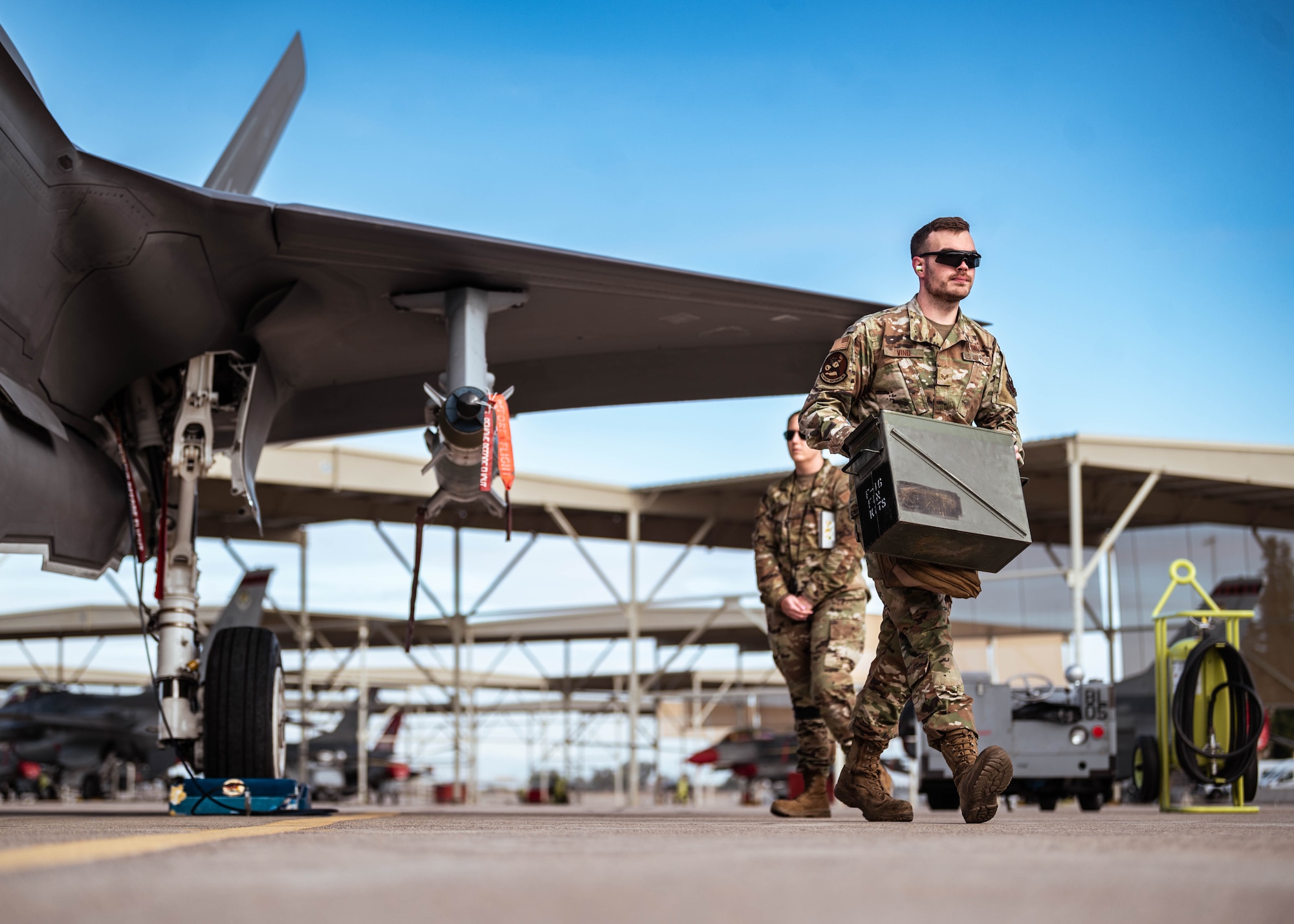U.S. Air Force Senior Airman Aaron Vind, 62nd Aircraft Maintenance Unit weapons load crew member, hauls equipment during the annual weapons load competition.