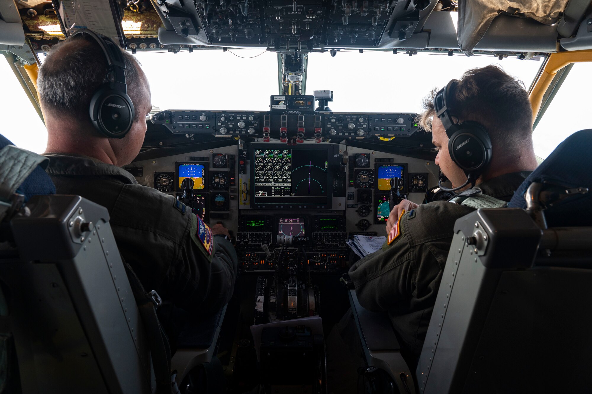U.S. Air Force Capt. Philip Campbell (Left) and 1st Lt. Forest Staggs (Right), 384th Aerial Refueling Squadron KC-135 Stratotanker pilots, operate a KC-135, assigned to the 92nd Aerial Refueling Wing, during Mobility Guardian 23 over the Indo-Pacific region, July 14, 2023. 3,000 personnel directly supported the large-scale mobility exercise, which provided the maneuver of more than 15,000 U.S. and international forces associated with other exercises across the Indo-Pacific held in the same timeframe. (U.S. Air Force photo by Tech. Sgt. Heather Clements)