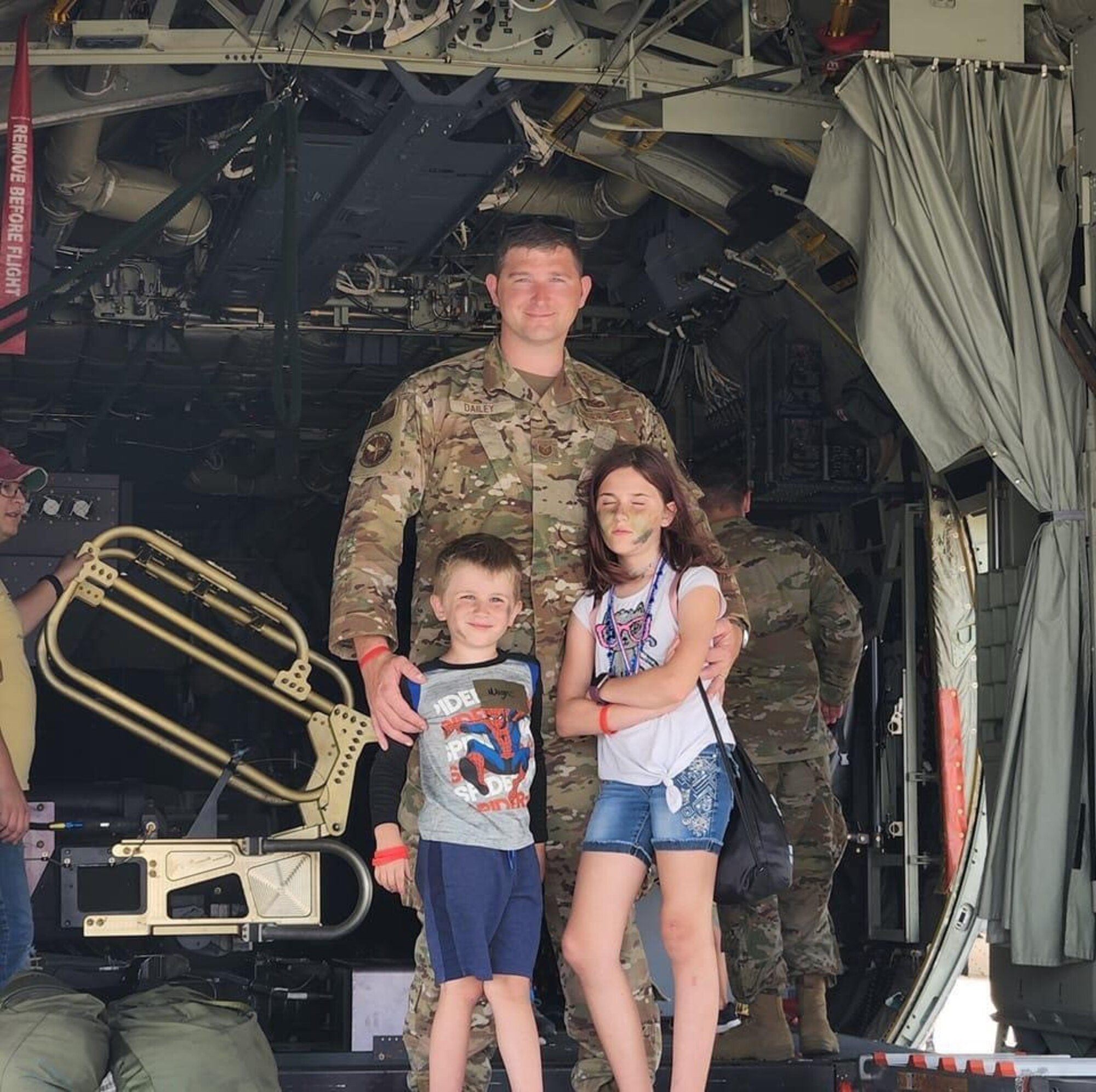 U.S. Air Force Tech. Sgt. Timothy Dailey, 1st Special Operations Security Forces Squadron noncommissioned officer in charge of standardization and evaluations, poses for a photo with his children at Hurlburt Field, Florida. Dailey's family has had to learn to adjust to either parent being gone for extended periods of time. Their family has been able to utilize the multitude of resources Air Force Special Operations Command offers to ensure Air Commandos are taken care of in each aspect of their lives; professionally, physically, mentally, medically and spiritually, to be ready to perform mission essential duties at a moment’s notice. (Courtesy photo)