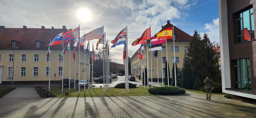 Multinational flags outside of a warfighter symposium in Szczecin, Poland on Feb. 07, 2024. The second warfighter symposium was held to continue dialogue on military tactics to create interoperability between the U.S., Poland and other NATO forces. (U.S. Army Reserve photo by Sgt. Peter Martinez)