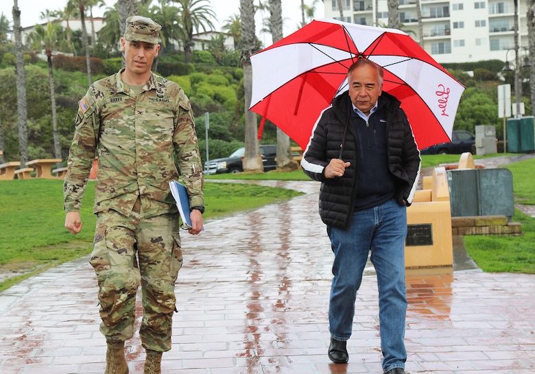 Col. Andrew Baker, commander of the U.S. Army Corps of Engineers Los Angeles District, left, and Victor Cabral, mayor of San Clemente, right, meet during a rainy Feb. 9 day near the San Clemente Pier in San Clemente, California. The two leaders met to discuss the next steps for the San Clemente Beach Nourishment project and address some of the city’s concerns.