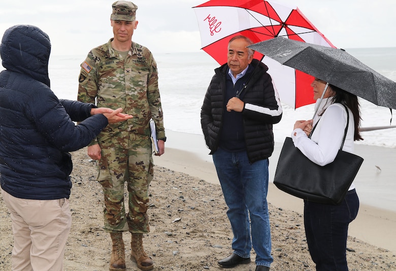 U.S. Army Corps of Engineers Los Angeles District Commander Col. Andrew Baker, center; San Clemente Mayor Victor Cabral, second from right; and San Clemente Coastal Administrator Leslea Meyerhoff, right, listen as Doland Cheung, the Corps’ LA District project manager, left, provides updates on the San Clemente Beach Nourishment Project during a Feb. 9 visit to the project site in San Clemente, California.