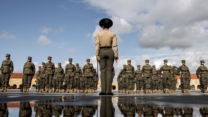 U.S. Marine Sgt. Destiny Dempsey, a drill instructor with Mike Company, 3rd Recruit Training Battalion, forms her platoon for initial drill at Marine Corps Recruit Depot San Diego, Feb. 9, 2024. The initial drill evaluation tests each platoon's ability to listen to the orders of their drill instructor, and acts as a demonstration of the unit's degree of discipline and esprit de corps. (U.S. Marine Corps photo by Sgt. Yvonna Guyette)