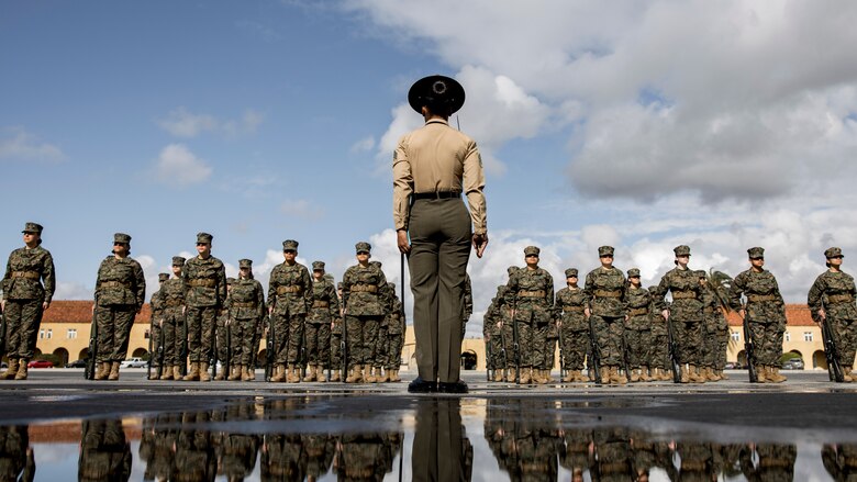 U.S. Marine Sgt. Destiny Dempsey, a drill instructor with Mike Company, 3rd Recruit Training Battalion, forms her platoon for initial drill at Marine Corps Recruit Depot San Diego, Feb. 9, 2024. The initial drill evaluation tests each platoon's ability to listen to the orders of their drill instructor, and acts as a demonstration of the unit's degree of discipline and esprit de corps. (U.S. Marine Corps photo by Sgt. Yvonna Guyette)