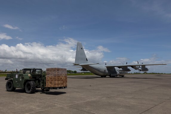 A Light Capacity Rough Terrain Forklift with Marine Wing Support Squadron 172, 1st Marine Aircraft Wing, moves an offloaded pallet of Department of Social Welfare and Development family food packs from Villamor Air Base at Davao International Airport, Davao City, Philippines, Feb. 12, 2024. At the request of the Government of the Philippines, the U.S. Marines of III Marine Expeditionary Force are supporting the U.S. Agency for International Development in providing foreign humanitarian assistance to the ongoing disaster relief mission in Mindanao. The forward presence and ready posture of III MEF assets in the region facilitated rapid and effective response to crisis, demonstrating the U.S.’s commitment to Allies and partners during times of need. (U.S. Marine Corps photo by Sgt. Savannah Mesimer)