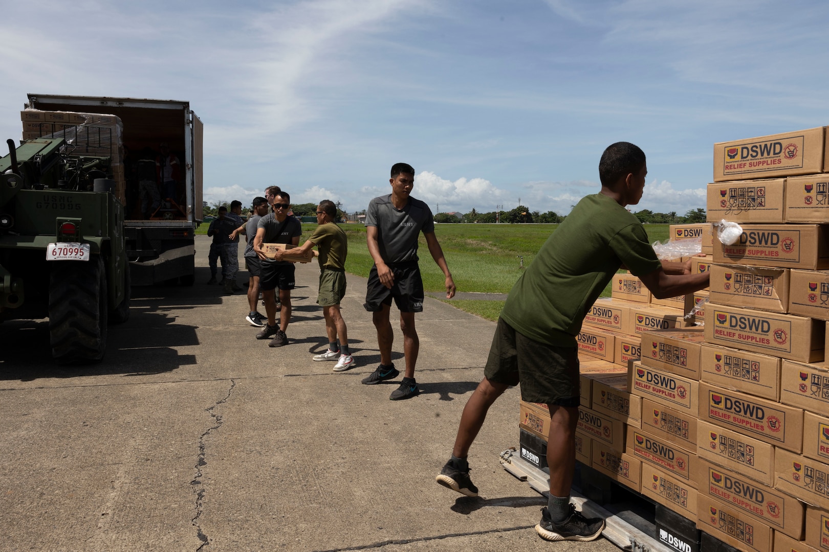 U.S. Marines with Marine Aerial Refueler Transport Squadron 152, 1st Marine Aircraft Wing, alongside Philippine Air Force service members load Department of Social Welfare and Development family food packs onto a truck for transportation at Davao International Airport, Davao City, Philippines, Feb. 12, 2024. At the request of the Government of the Philippines, the U.S. Marines of III Marine Expeditionary Force are supporting the U.S. Agency for International Development in providing foreign humanitarian assistance to the ongoing disaster relief mission in Mindanao. The forward presence and ready posture of III MEF assets in the region facilitated rapid and effective response to crisis, demonstrating the U.S.’s commitment to Allies and partners during times of need. (U.S. Marine Corps photo by Sgt. Savannah Mesimer)