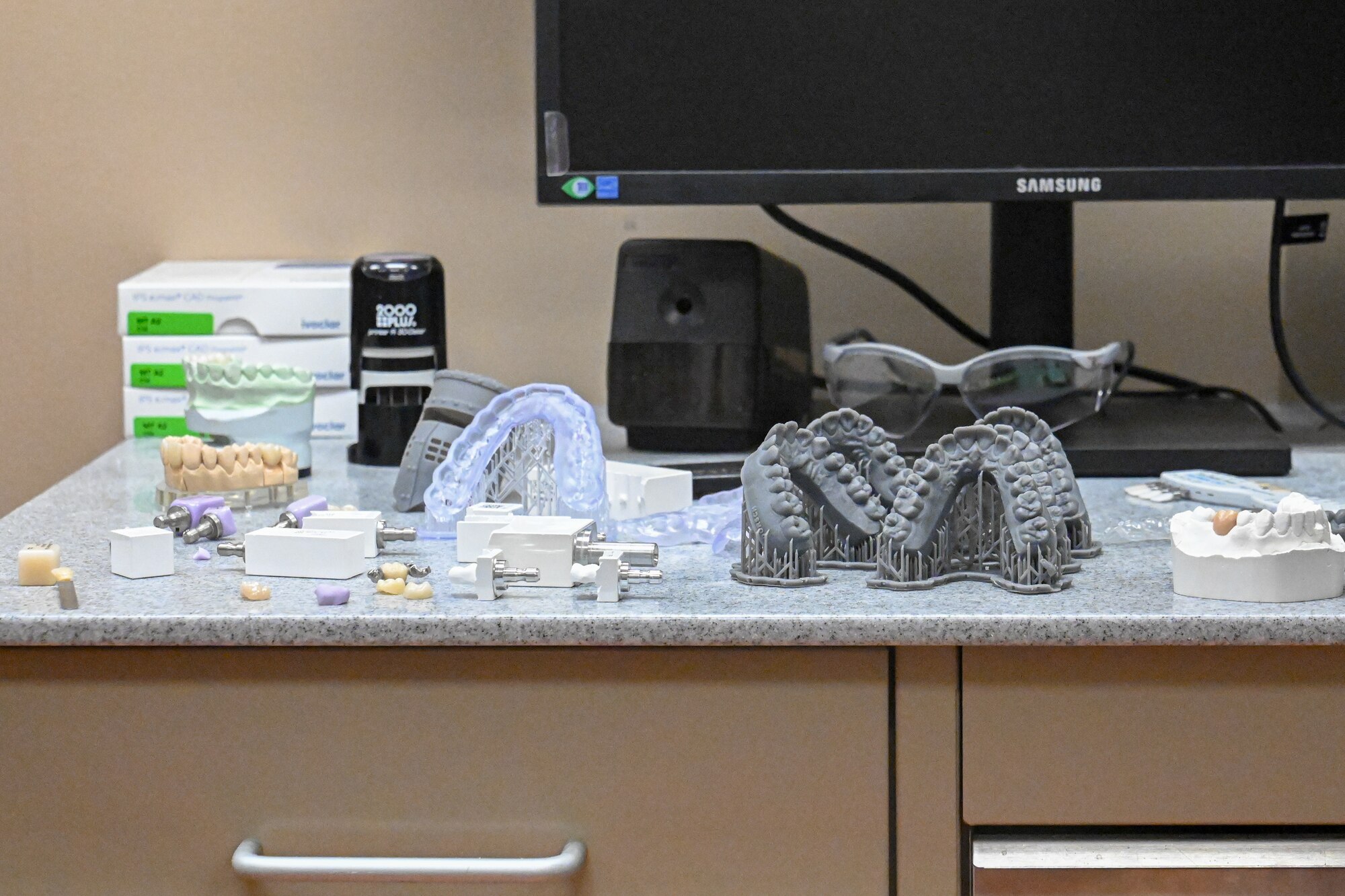 Dental equipment sits on a medical counter.