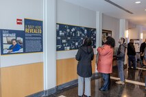 Invited guests read and learn about the career of a U.S. Navy icon, Raye Montague, in West Bethesda, Md