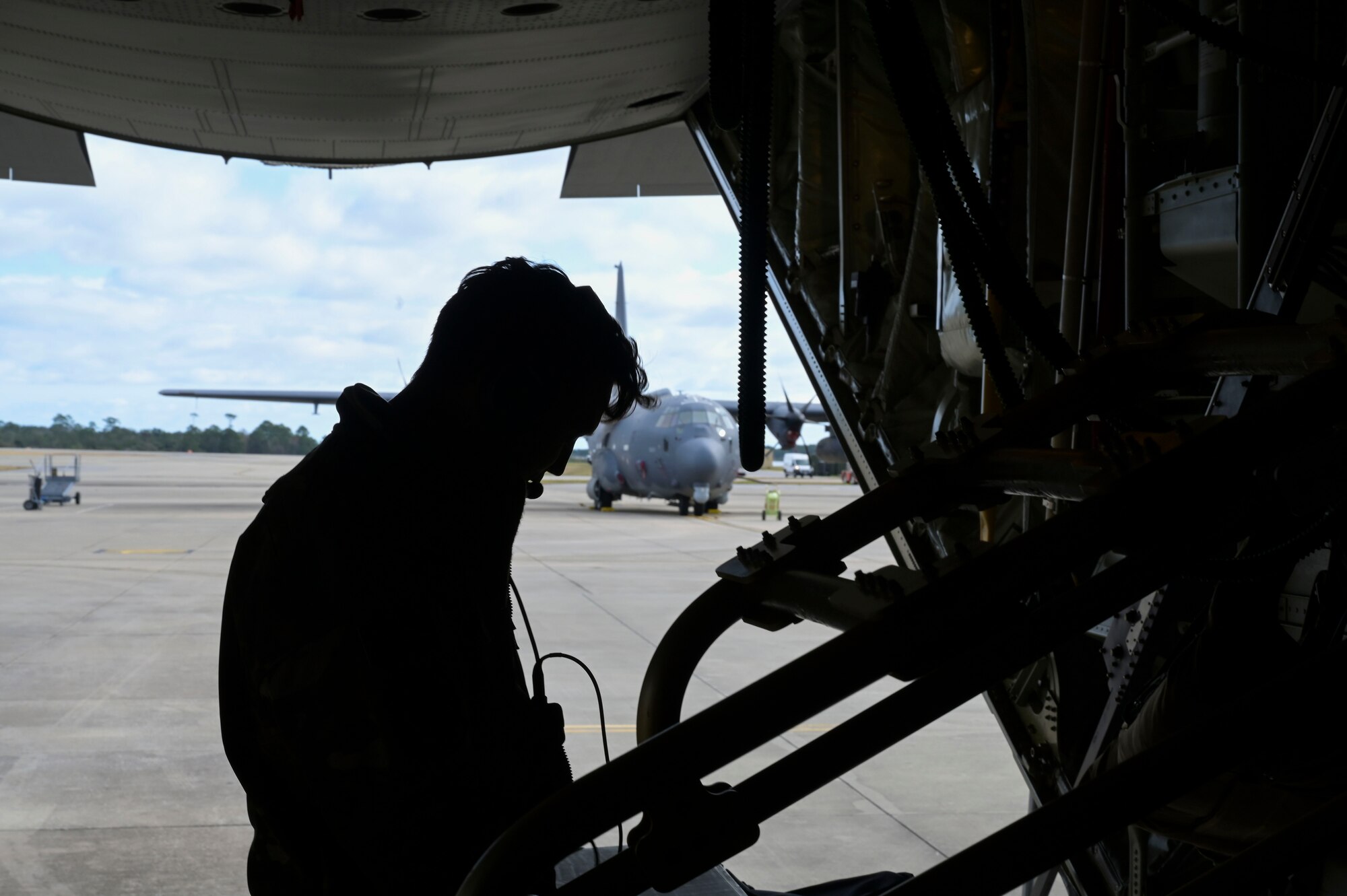 U.S. Air Force Tech. Sgt. Cody Troxel, a 73rd Special Operations Squadron special missions aviator, conducts pre-flight inspections on an AC-130J Ghostrider gunship during Agile Ghost at Hurlburt Field.
